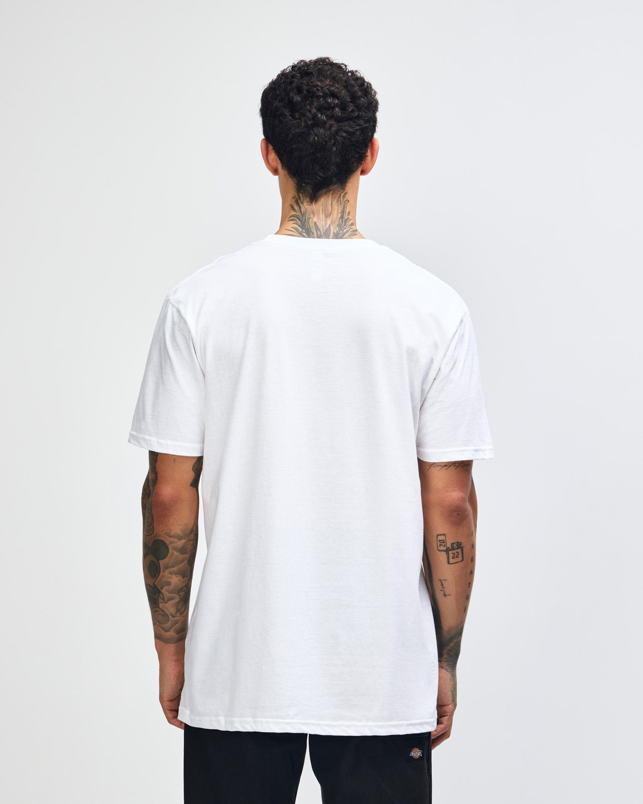 Male model wearing white colour CVC Unisex Short Sleeve Crew Neck Tee (back pose) -white