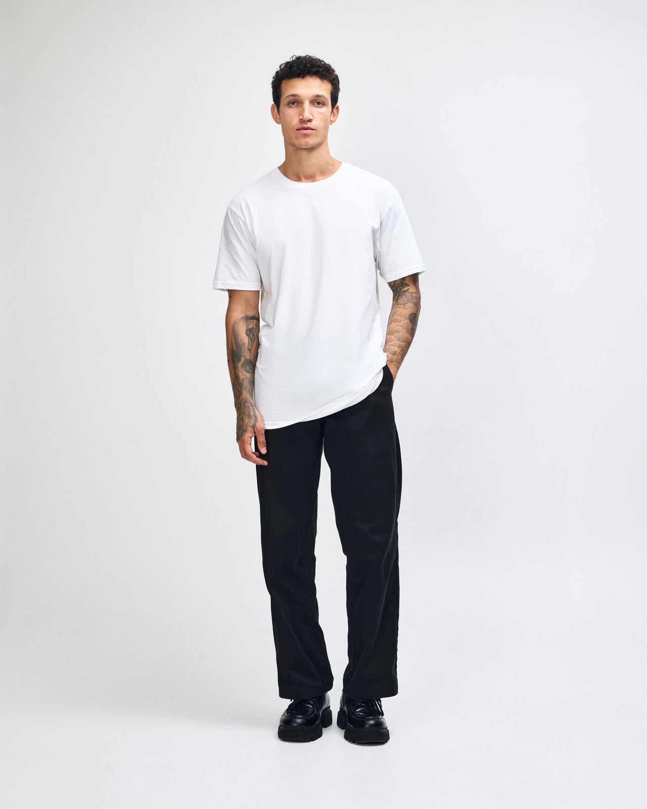 Male model wearing white colour CVC Unisex Short Sleeve Crew Neck Tee (front pose) -white