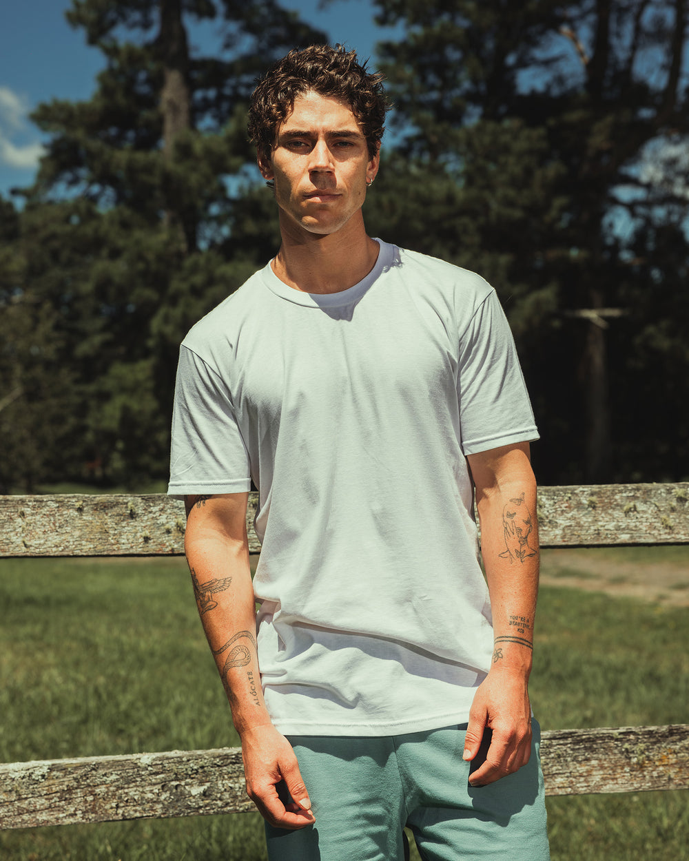 image of Unisex Cotton T-Shirt : Male model wearing white colour CVC Unisex Short Sleeve Crew Neck Tee (front pose) -white