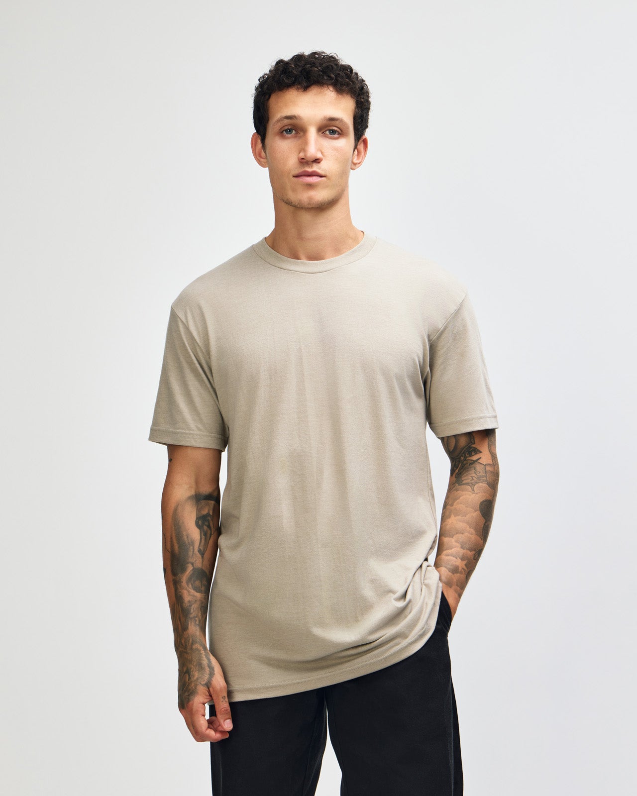 Male model wearing heather khaki colour CVC Unisex Short Sleeve Crew Neck Tee (front pose) -heather khaki