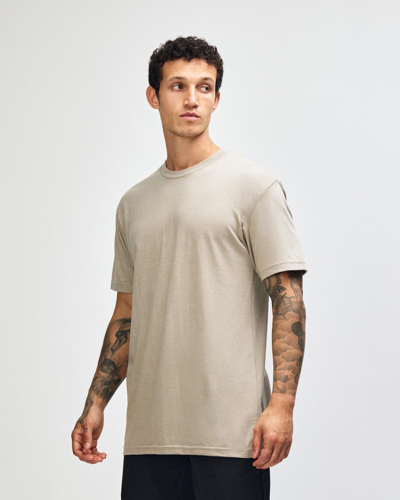 Male model wearing heather khaki colour CVC Unisex Short Sleeve Crew Neck Tee (front pose) -heather khaki
