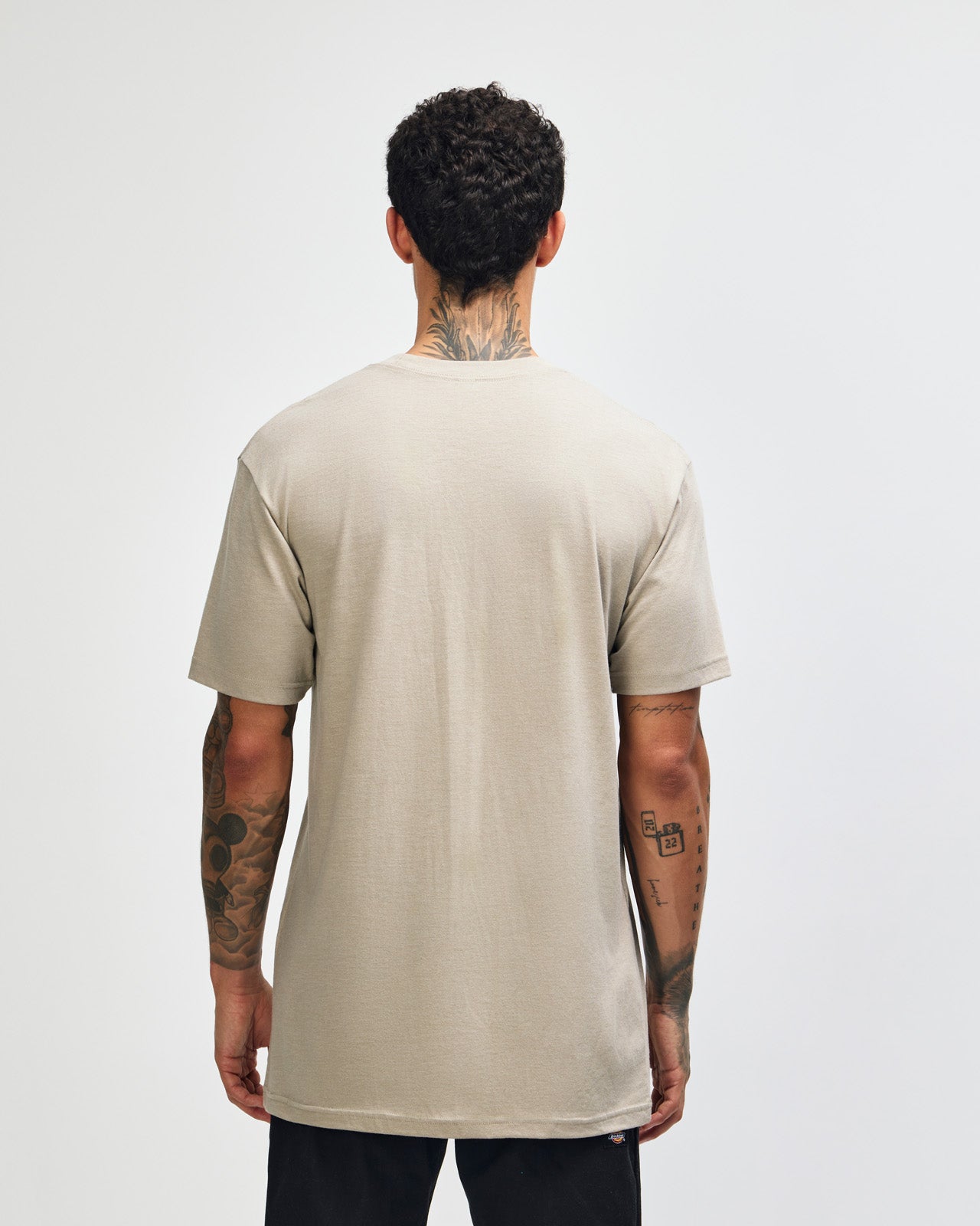 Male model wearing heather khaki colour CVC Unisex Short Sleeve Crew Neck Tee (back pose) -heather khaki