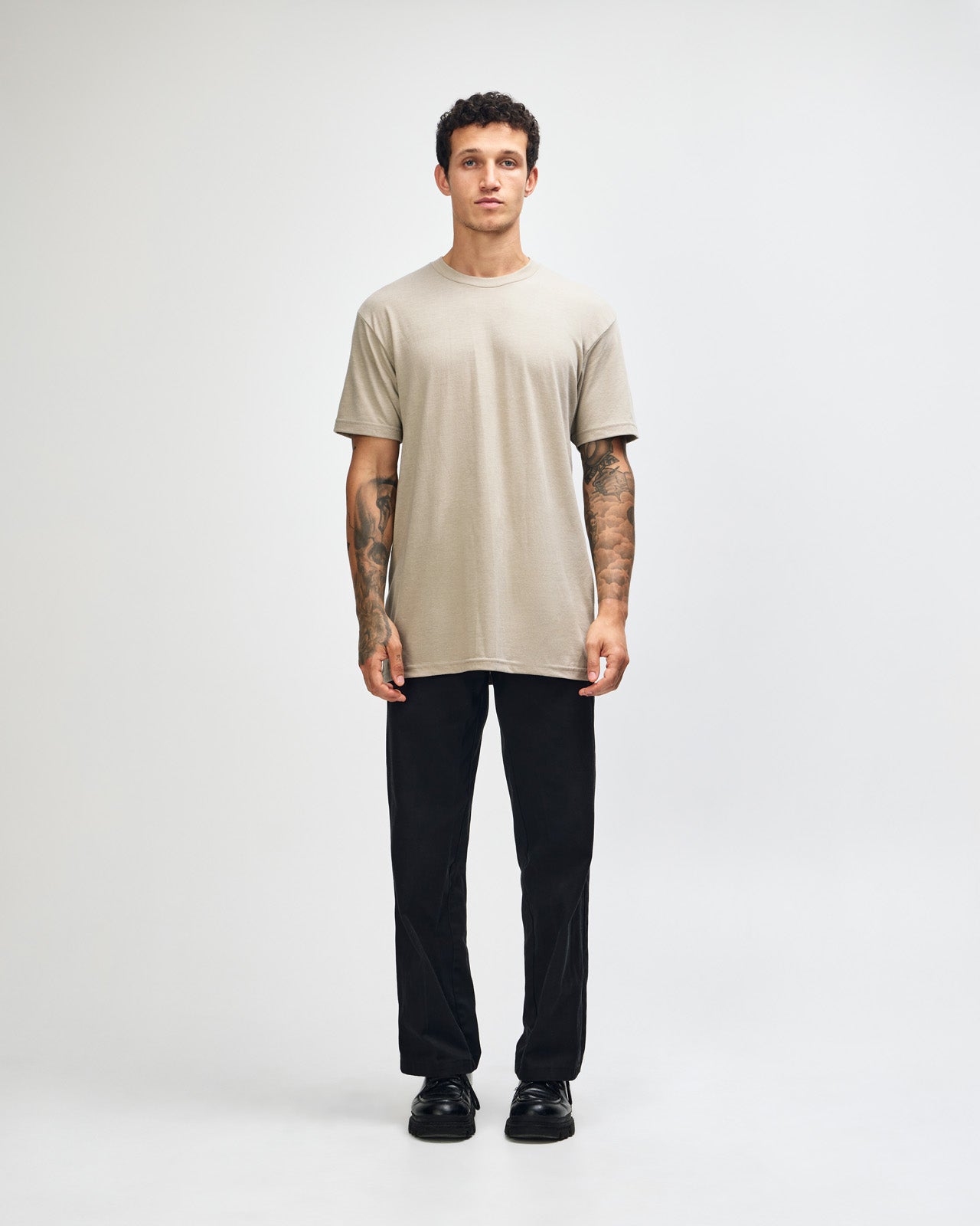 Male model wearing heather khaki colour CVC Unisex Short Sleeve Crew Neck Tee (front pose) -heather khaki