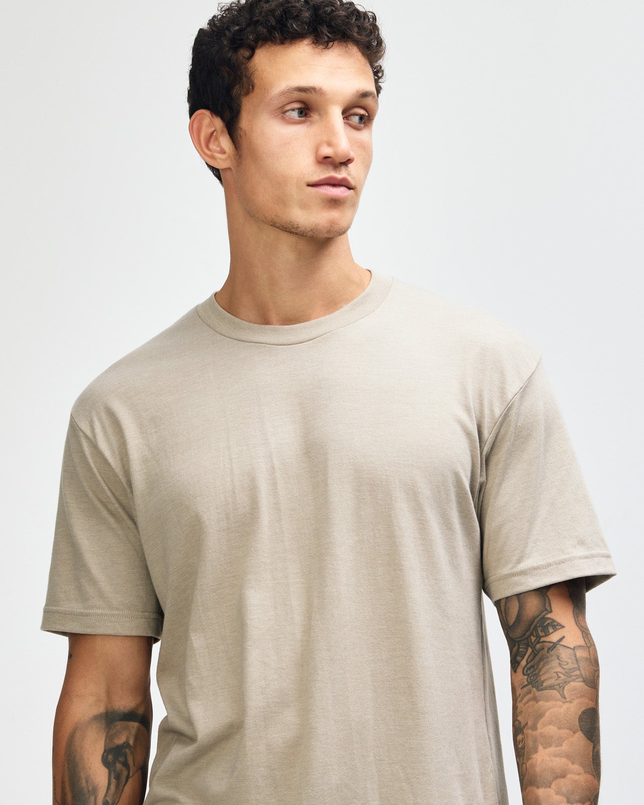 Male model wearing heather khaki colour CVC Unisex Short Sleeve Crew Neck Tee (front pose) -heather khaki