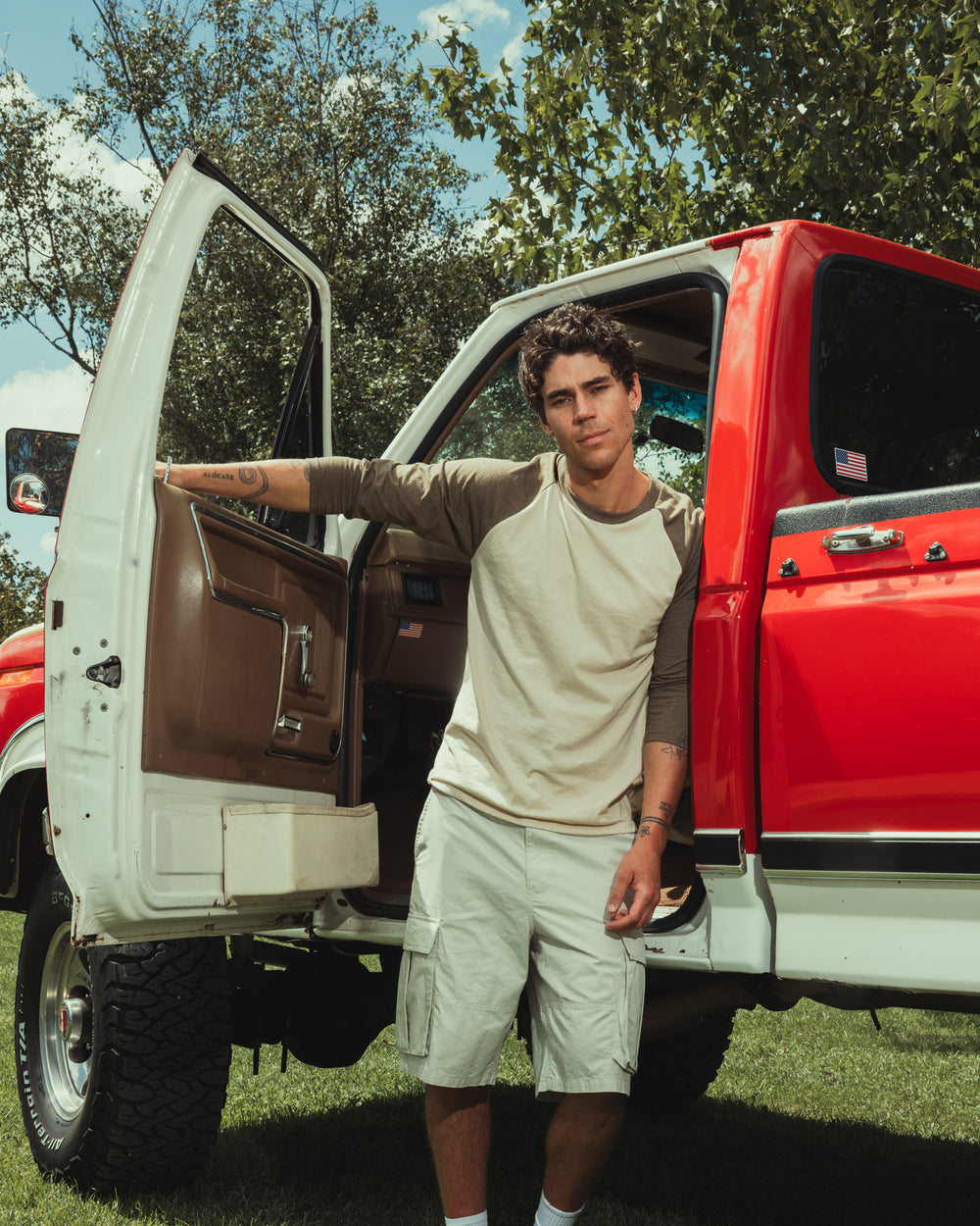 image of Unisex Raglan Tee : Male model wearing Heather Bone American Apparel CVC unisex raglan Tee (Front  pose) -heather bone