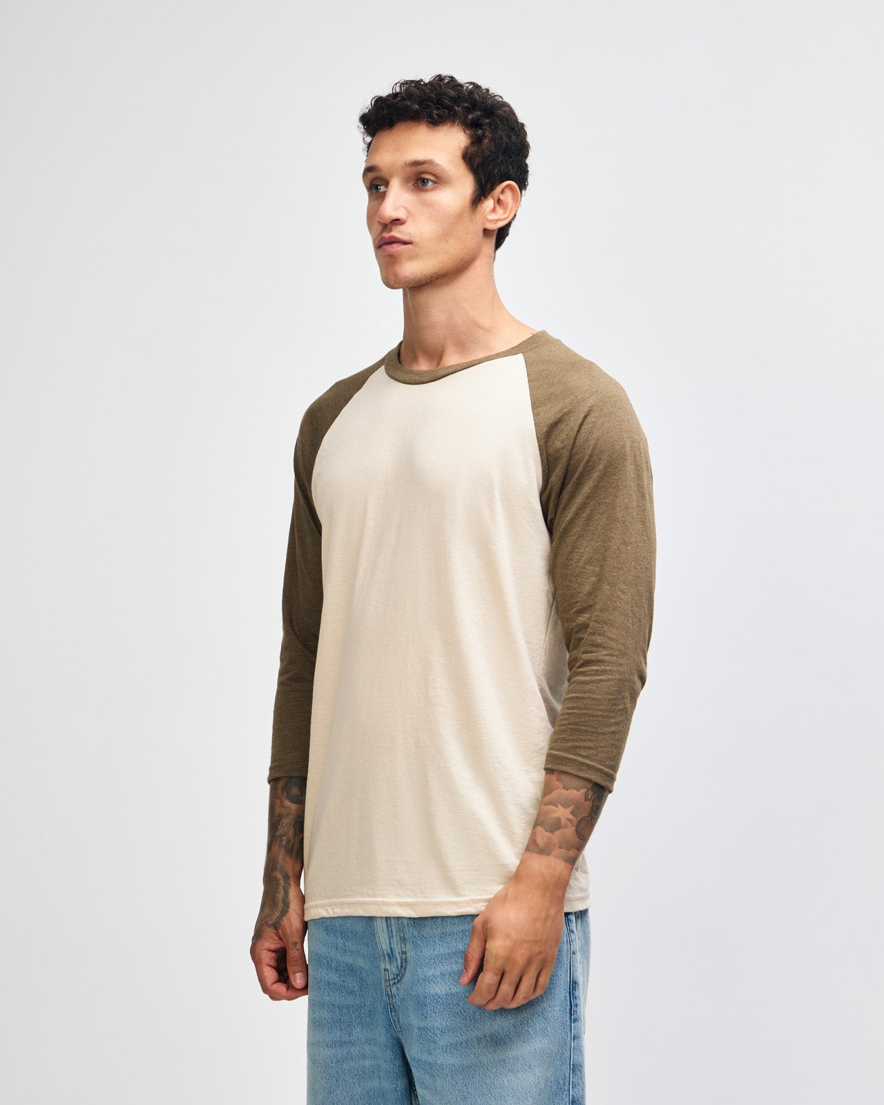 Male model wearing Heather Bone American Apparel CVC unisex raglan Tee (Front  pose) -heather bone