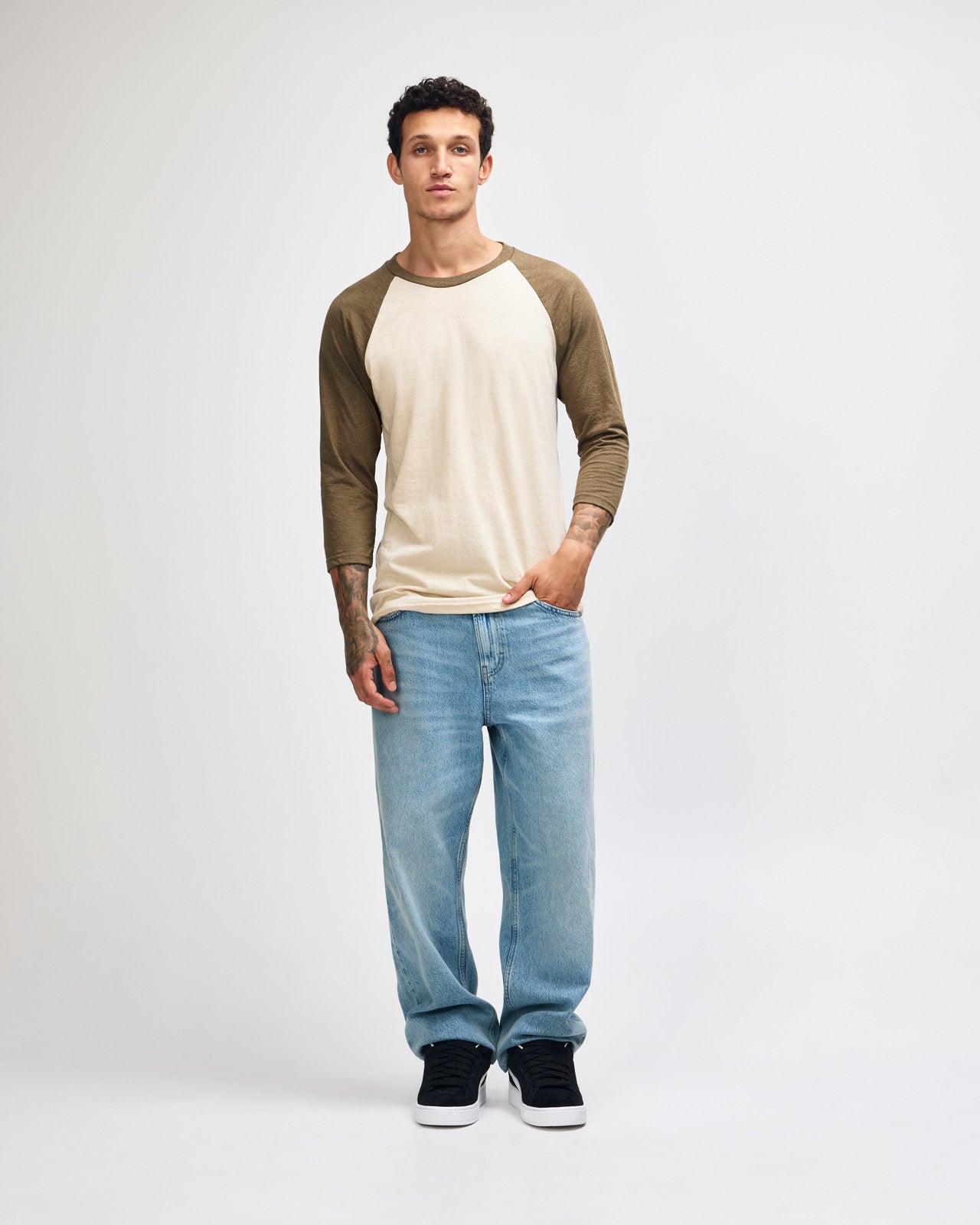 Male model wearing Heather Bone American Apparel CVC unisex raglan Tee (Front  pose) -heather bone