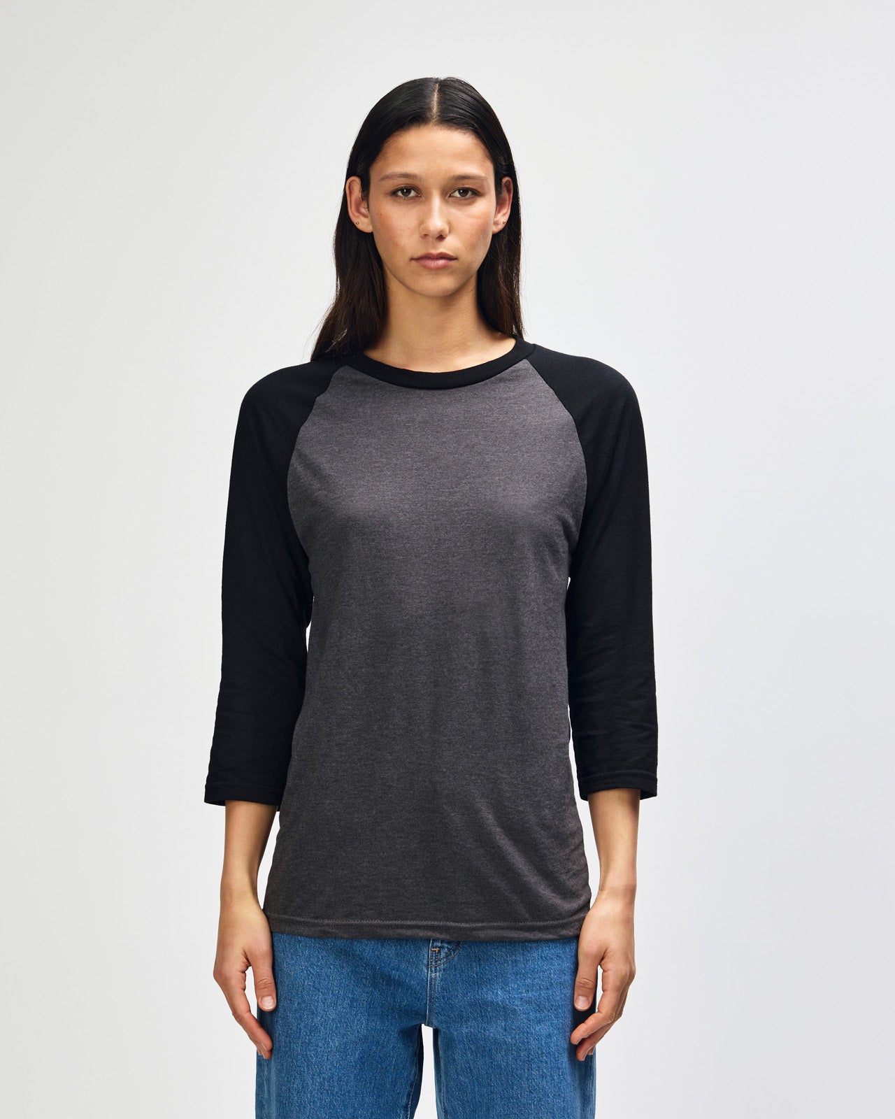 Female model wearing Heather Charcoal American Apparel CVC unisex raglan Tee (Front  pose) -heather charcoal
