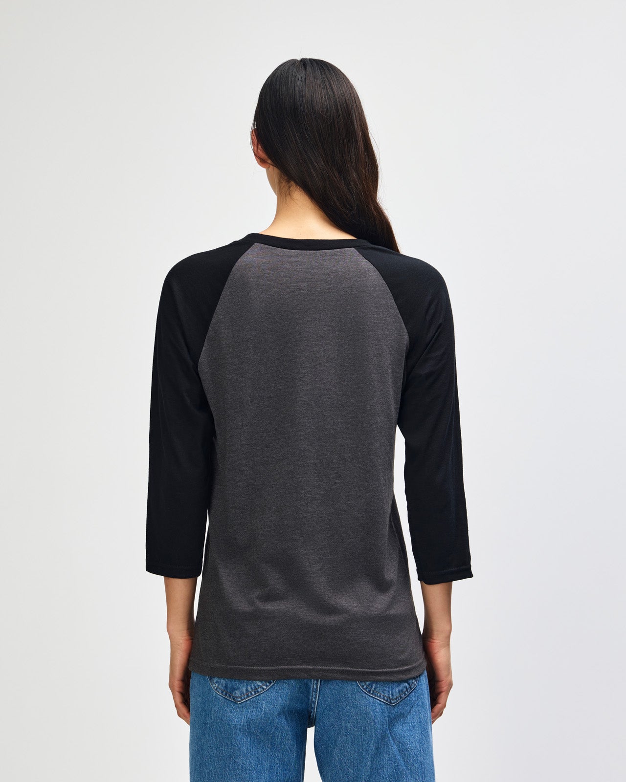 Female model wearing Heather Charcoal American Apparel CVC unisex raglan Tee (Front  pose) -heather charcoal