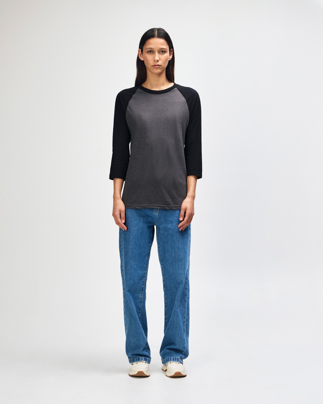 Female model wearing Heather Charcoal American Apparel CVC unisex raglan Tee (Front  pose) -heather charcoal