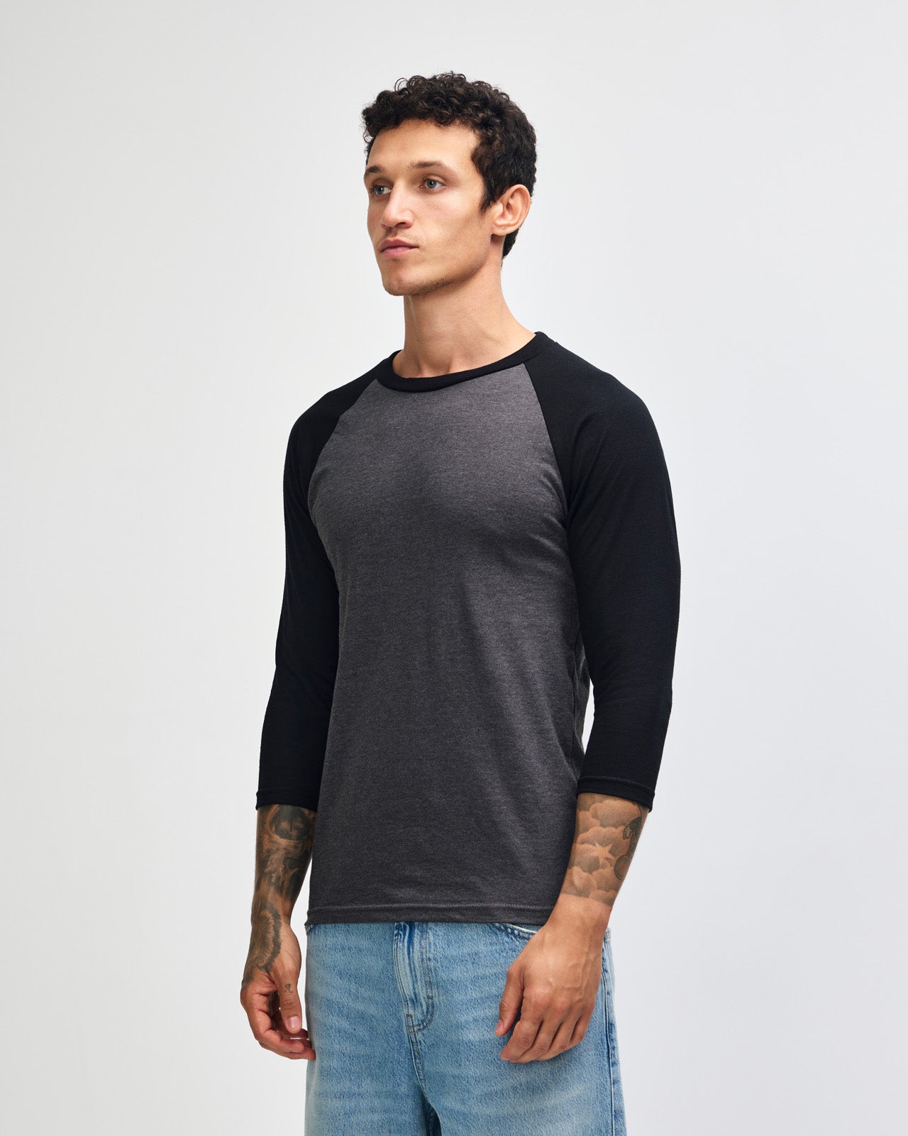 Male model wearing Heather Charcoal American Apparel CVC unisex raglan Tee (Front  pose) -heather charcoal