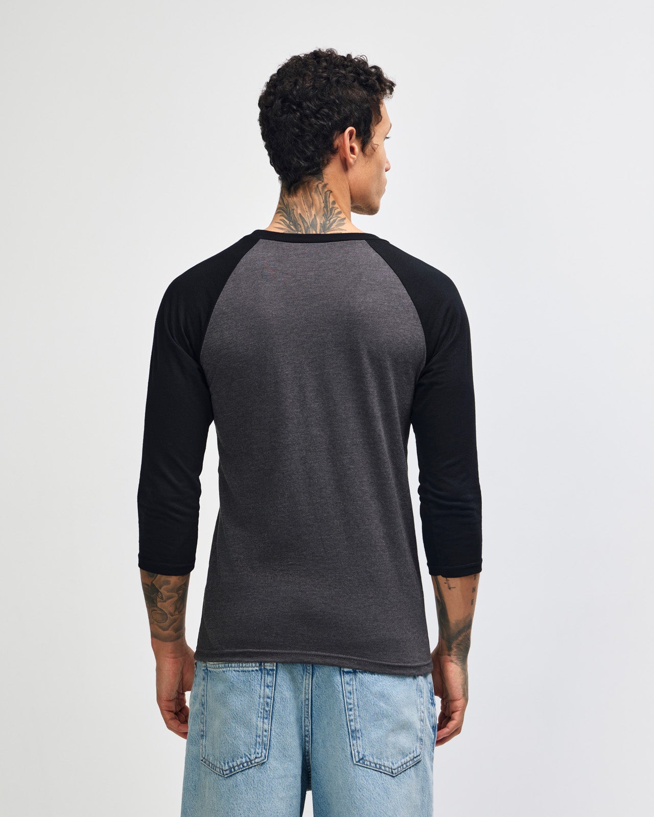 Male model wearing Heather Charcoal American Apparel CVC unisex raglan Tee (Front  pose) -heather charcoal