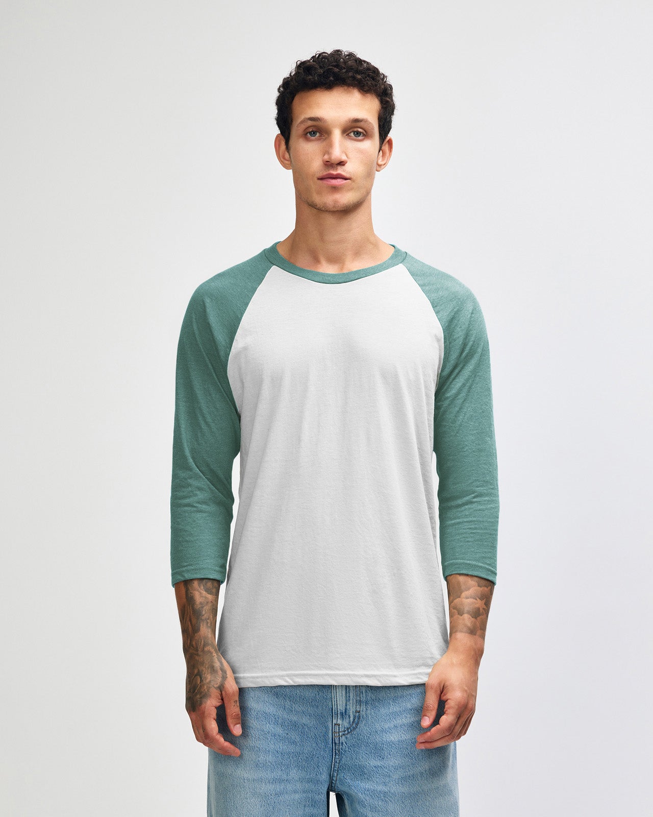 Male model wearing Heather Arctic American Apparel CVC unisex raglan Tee (Front pose) -heather arctic 