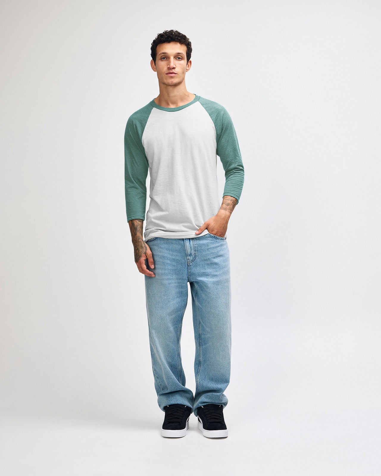 Male model wearing Heather Arctic American Apparel CVC unisex raglan Tee (Full size pose) -heather arctic 