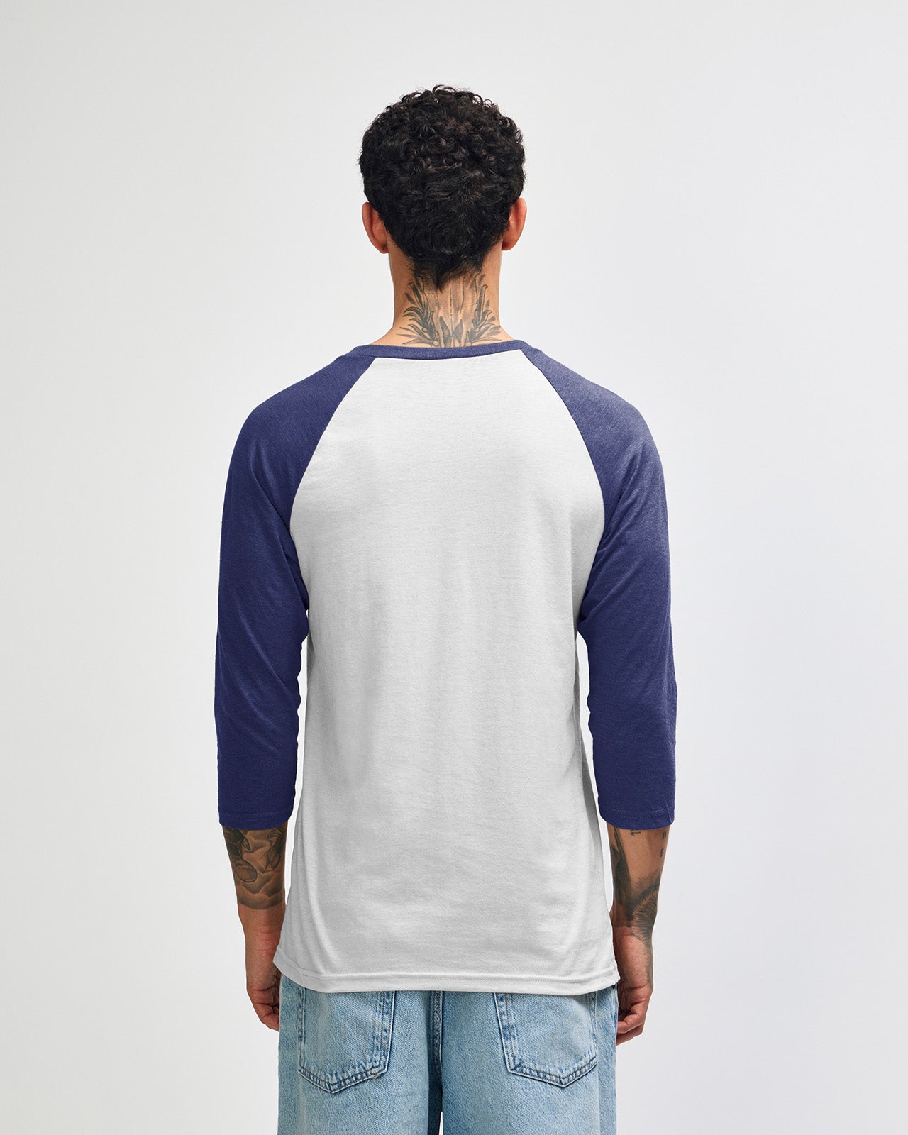 Male model wearing Heather Indigo American Apparel CVC unisex raglan Tee (front pose) -heather indigo 