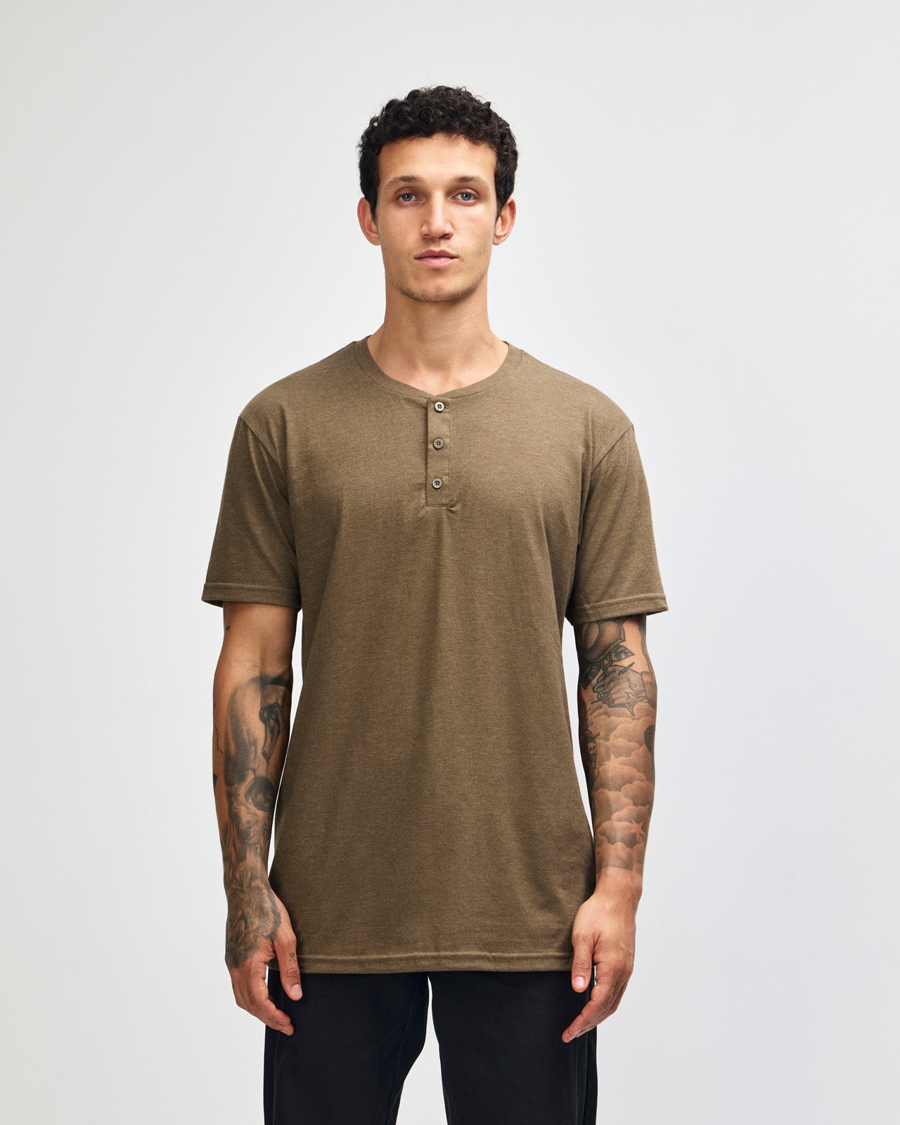 Male model wearing heather army Unisex Henley Tee (front pose) -heather army