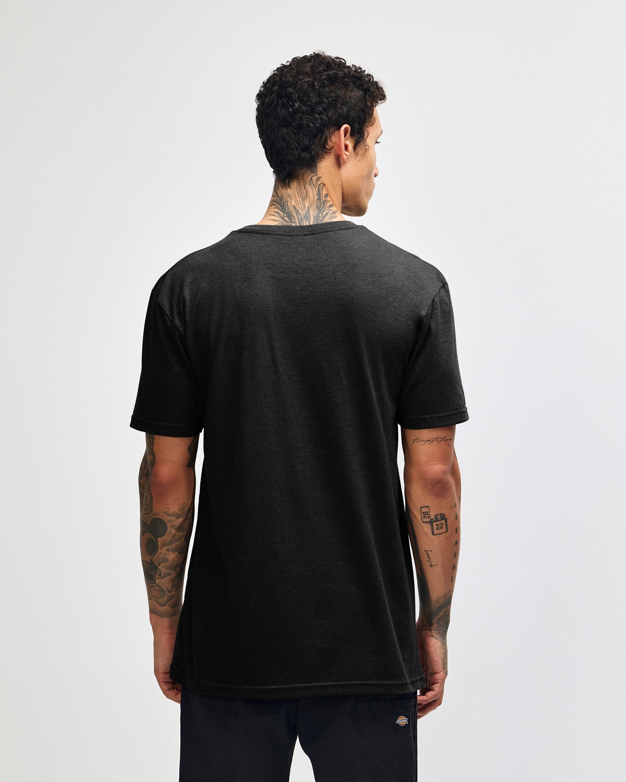 Male model wearing black colour Unisex Henley Tee (back pose) -black