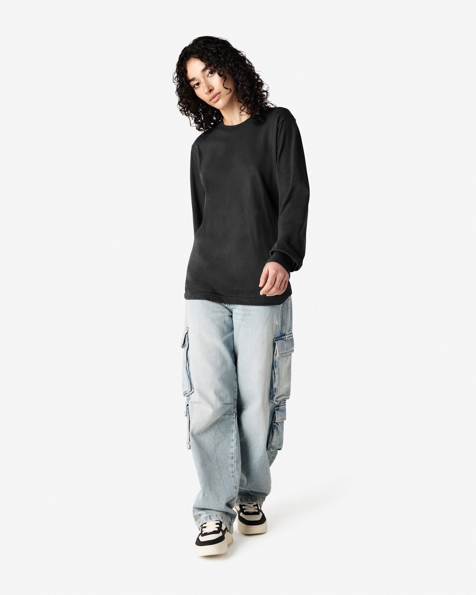 Female model wearing American Apparel Black Colour Fine Jersey Unisex Long Sleeve Crew Neck Tee (half Front pose) -black