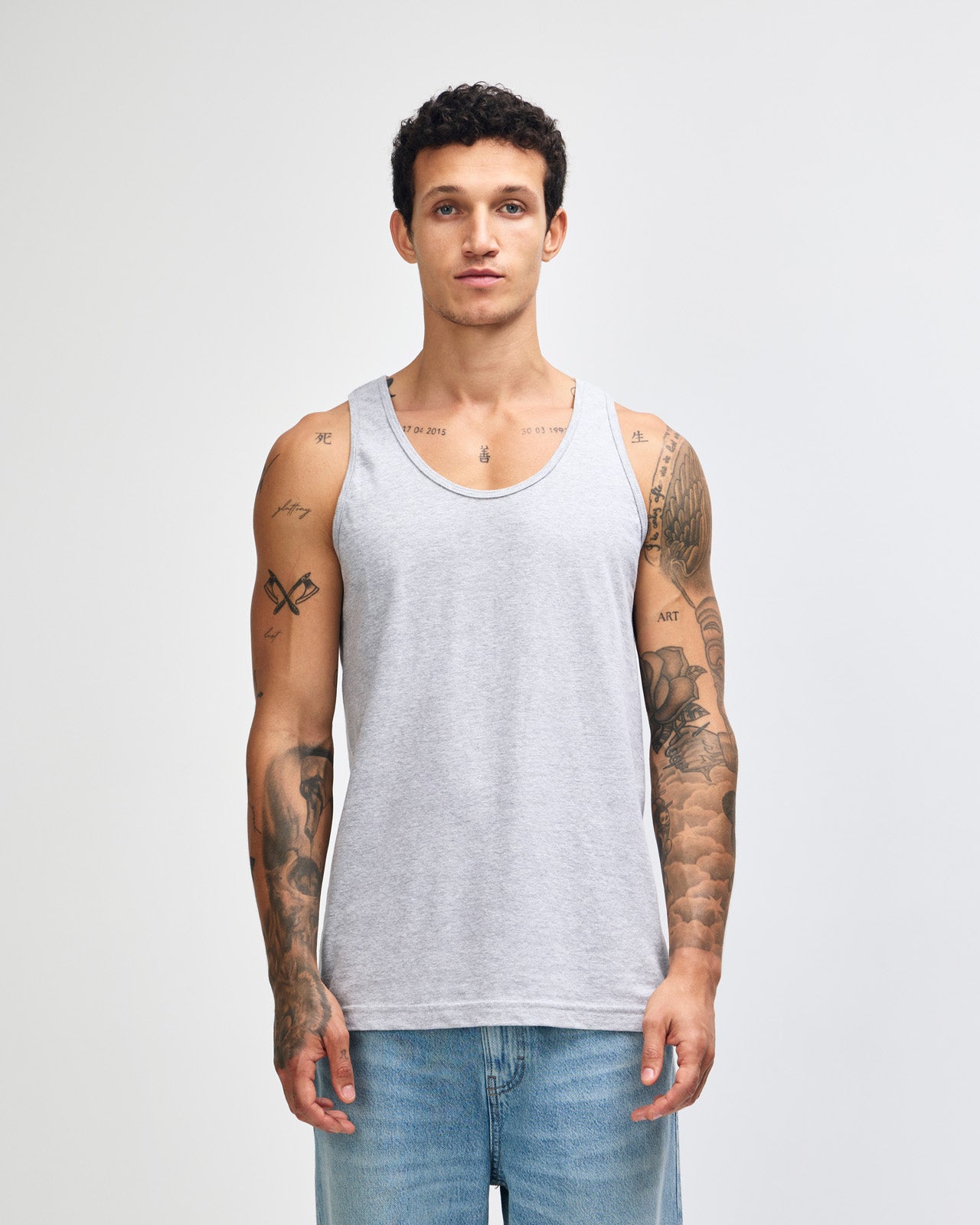 Male model wearing heather grey colour American Apparel Fine Jersey Unisex Tank Top (front pose) -heather grey