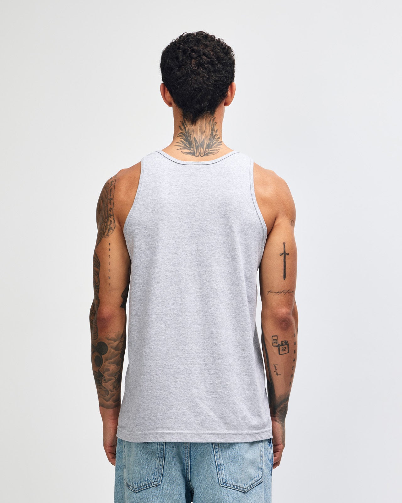 Male model wearing heather grey colour American Apparel Fine Jersey Unisex Tank Top (front pose) -heather grey
