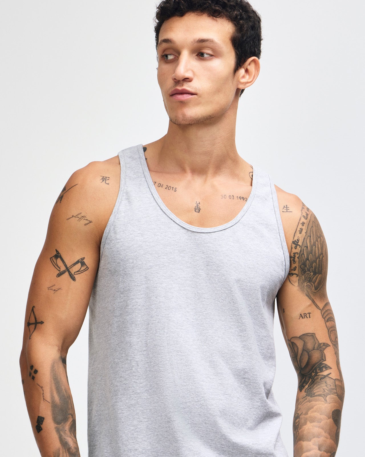 Male model wearing heather grey colour American Apparel Fine Jersey Unisex Tank Top (front pose) -heather grey