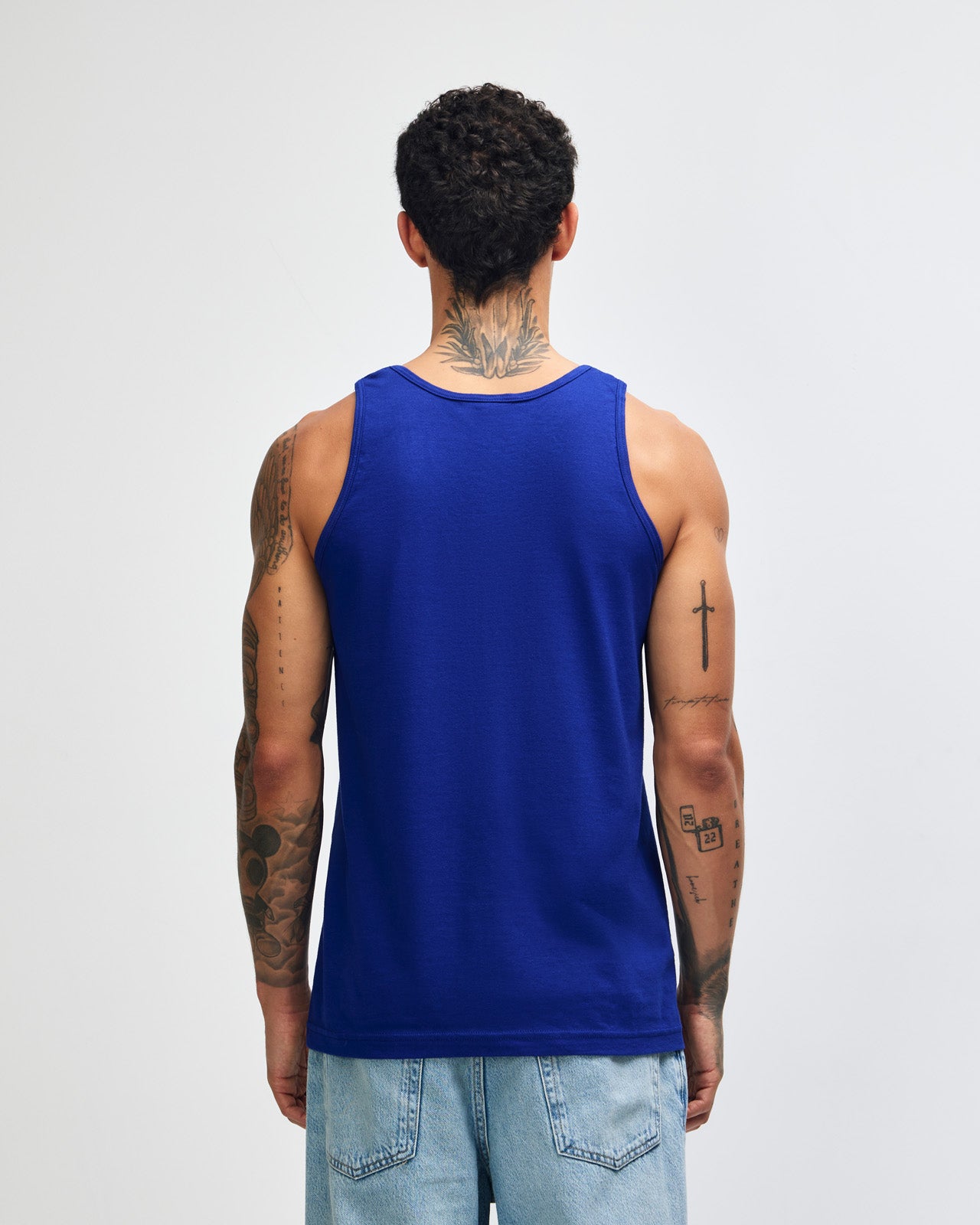 Male model wearing heather grey colour American Apparel Fine Jersey Unisex Tank Top (front pose) -lapis