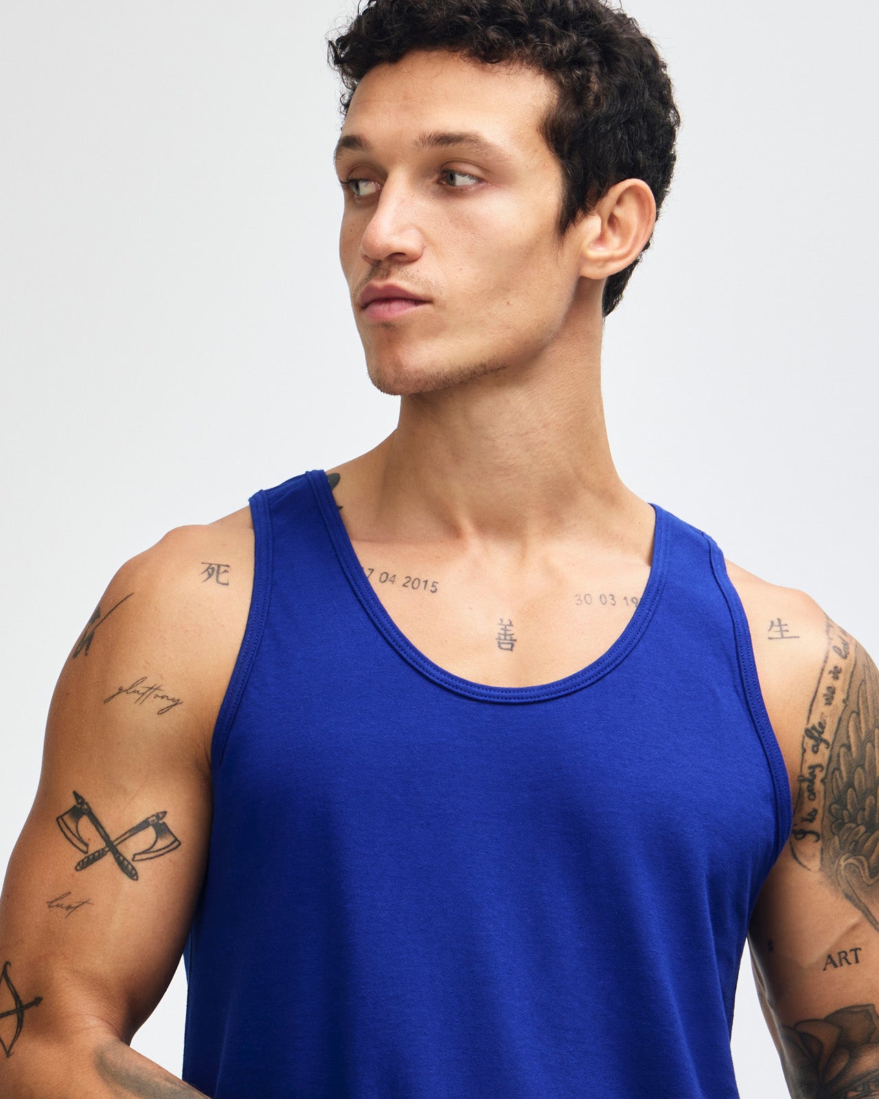 Male model wearing heather grey colour American Apparel Fine Jersey Unisex Tank Top (front pose) -lapis