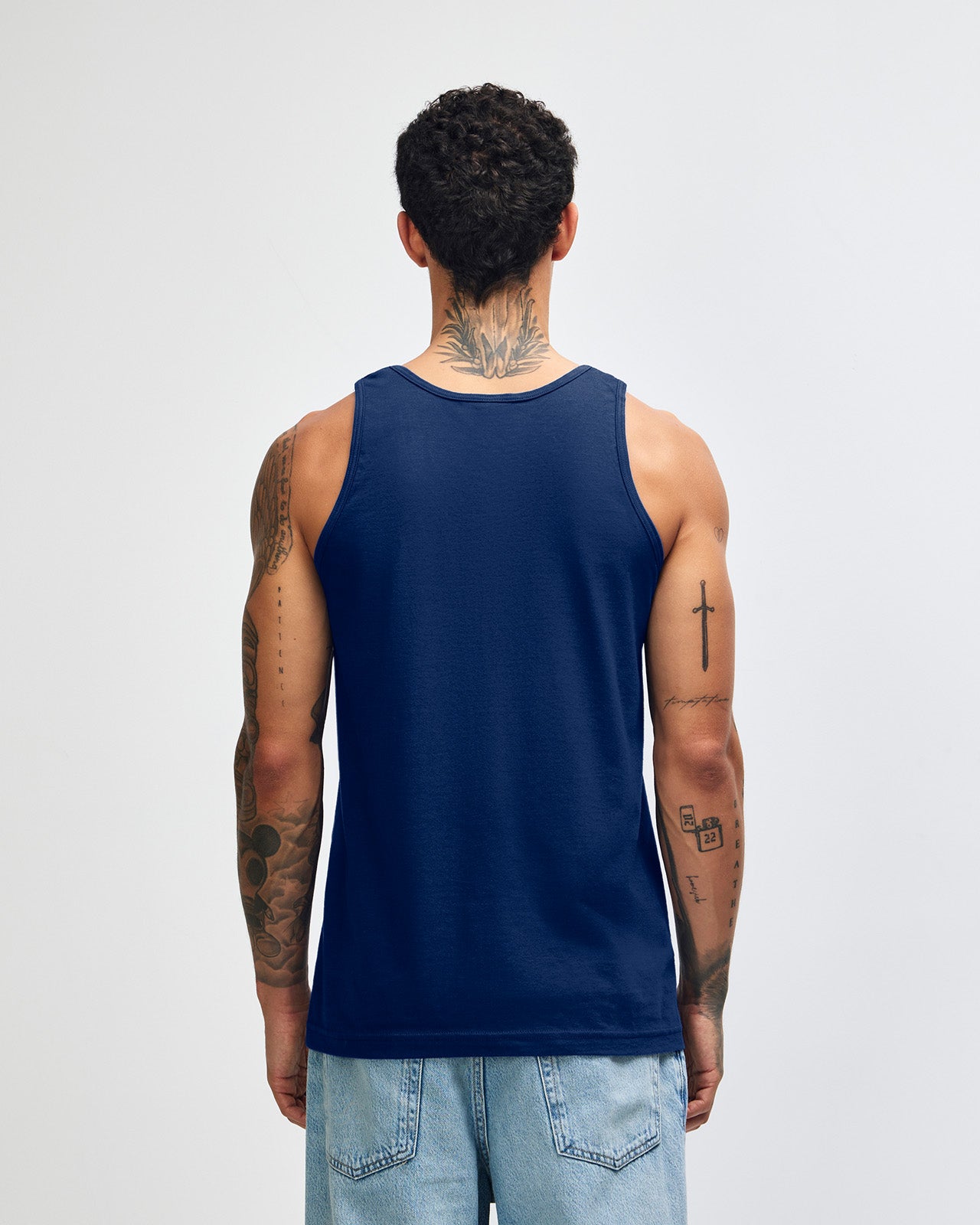 Male model wearing navy colour American Apparel Fine Jersey Unisex Tank Top (front pose) -navy