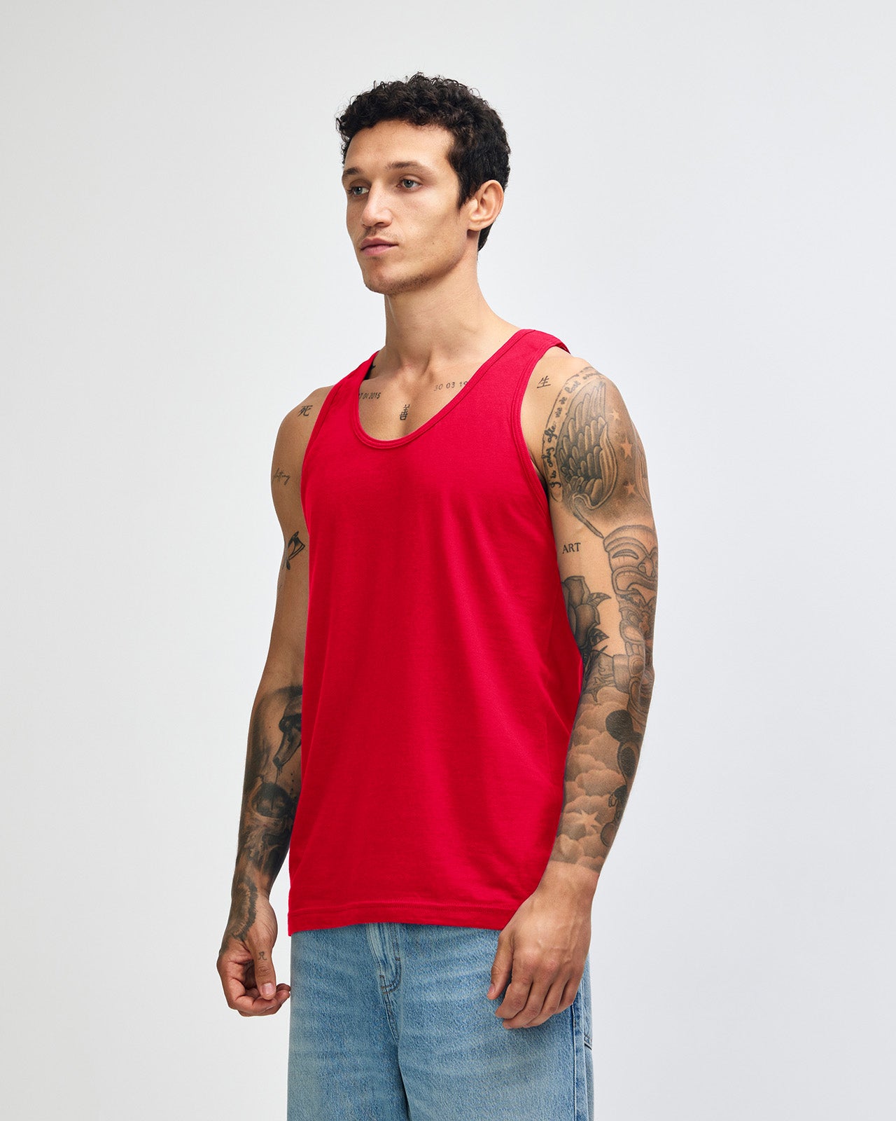 Male model wearing red colour American Apparel Fine Jersey Unisex Tank Top (front pose)-red