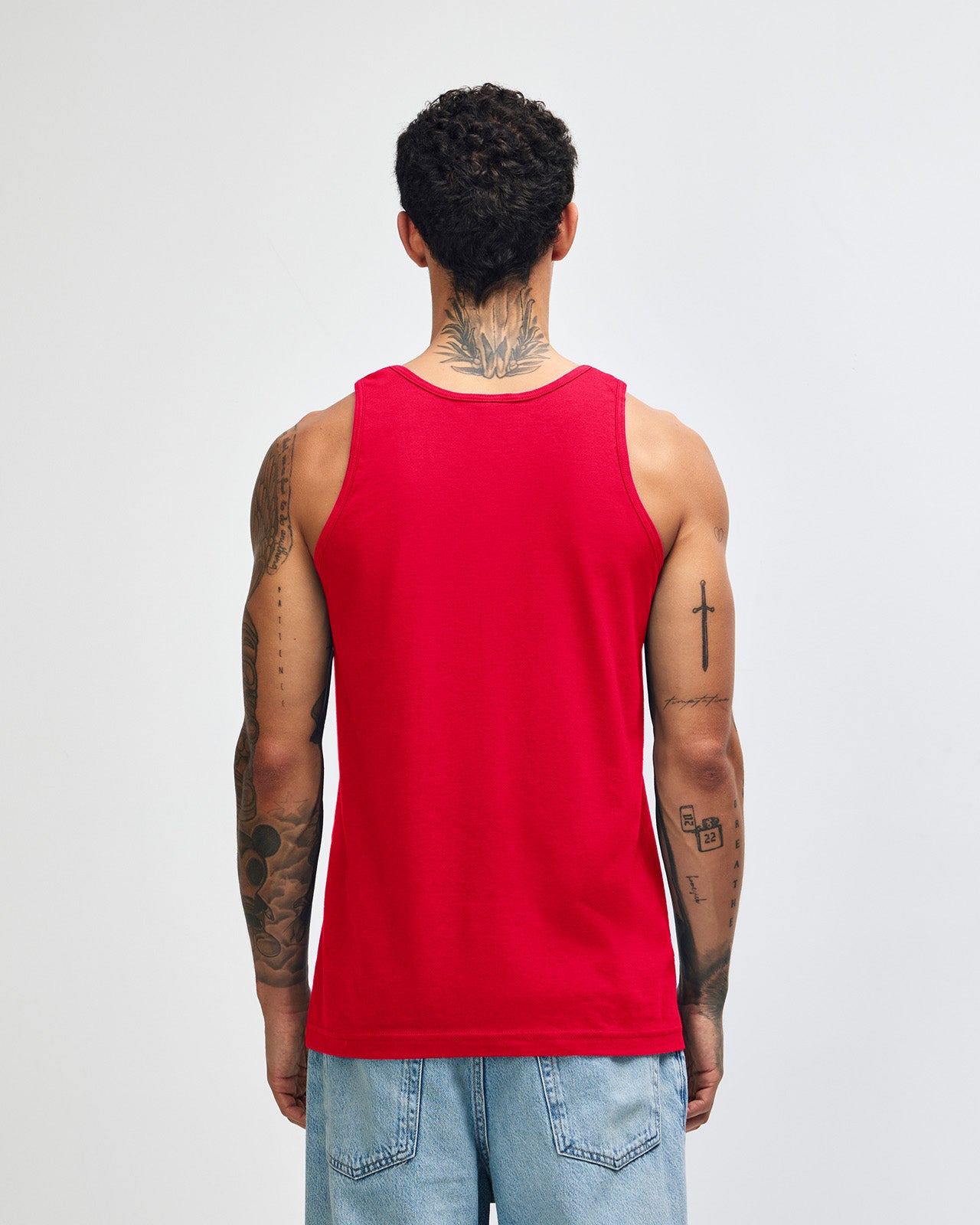 Male model wearing red colour American Apparel Fine Jersey Unisex Tank Top (front pose)-red