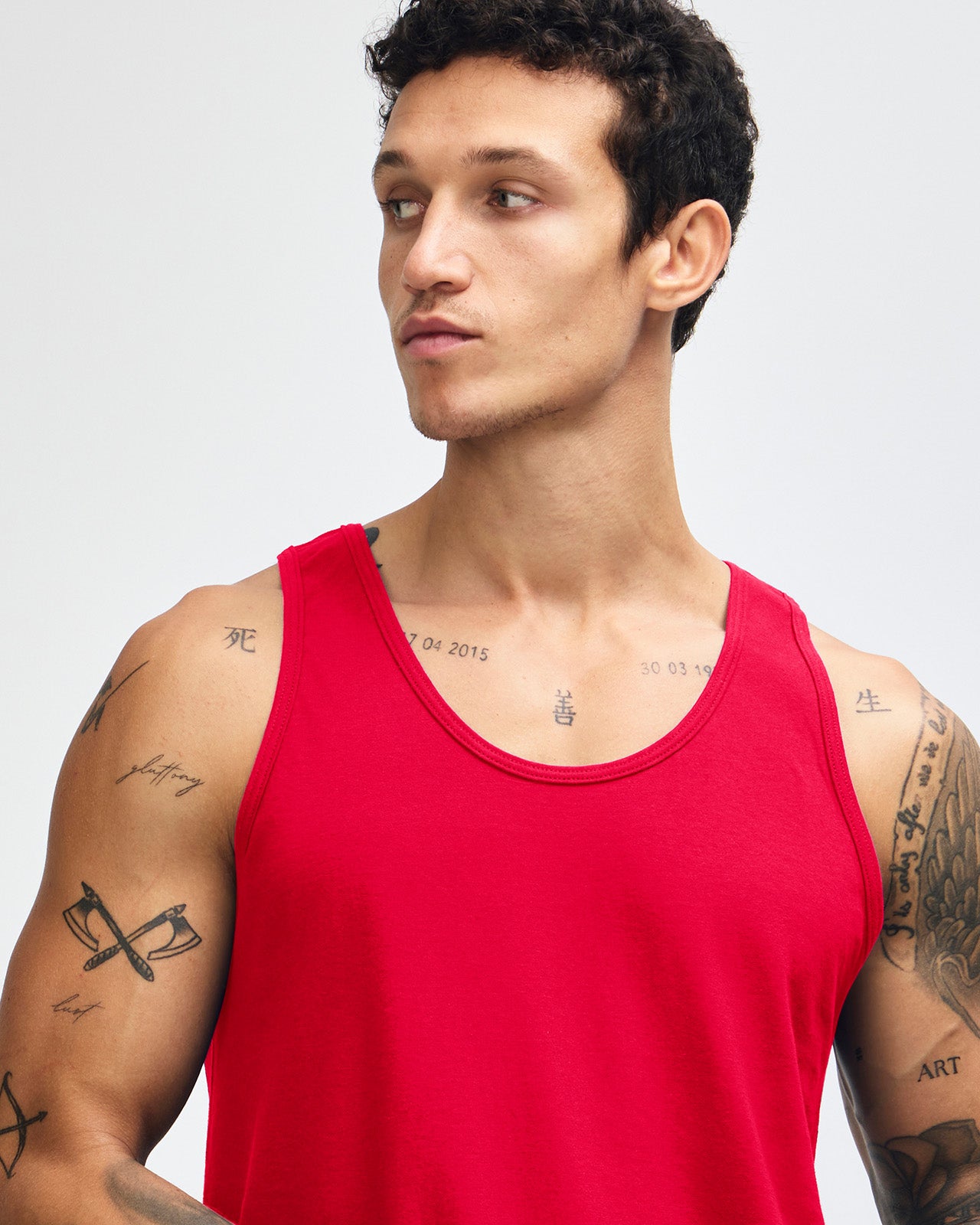 Male model wearing red colour American Apparel Fine Jersey Unisex Tank Top (front pose)-red