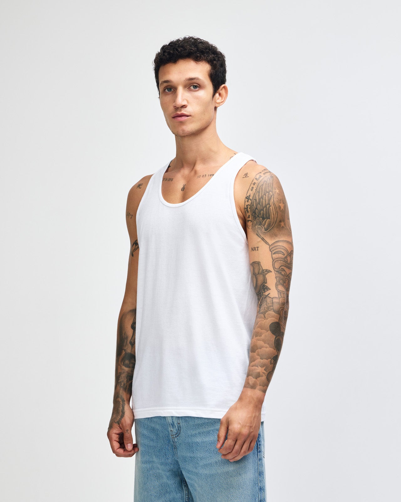 Male model wearing red colour American Apparel Fine Jersey Unisex Tank Top (front pose)-white