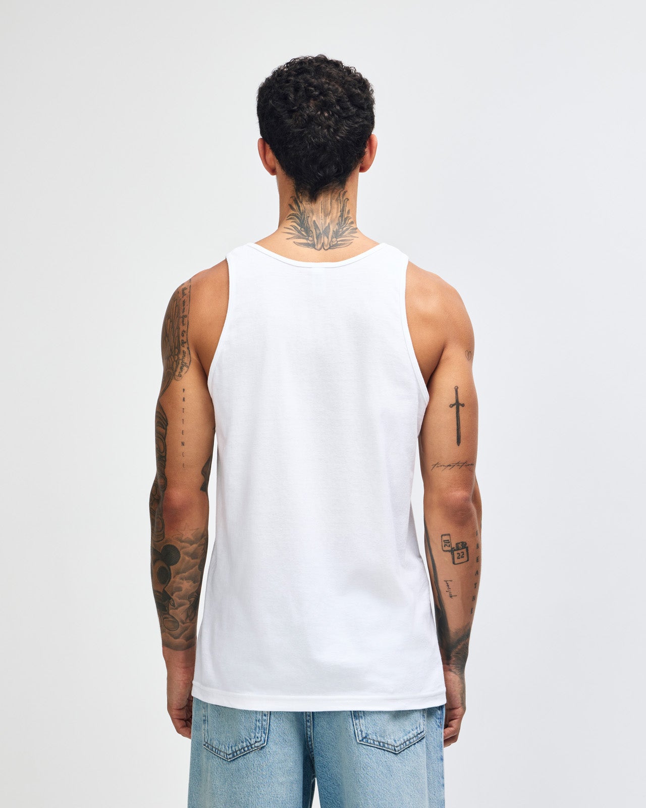 Male model wearing red colour American Apparel Fine Jersey Unisex Tank Top (front pose)-white