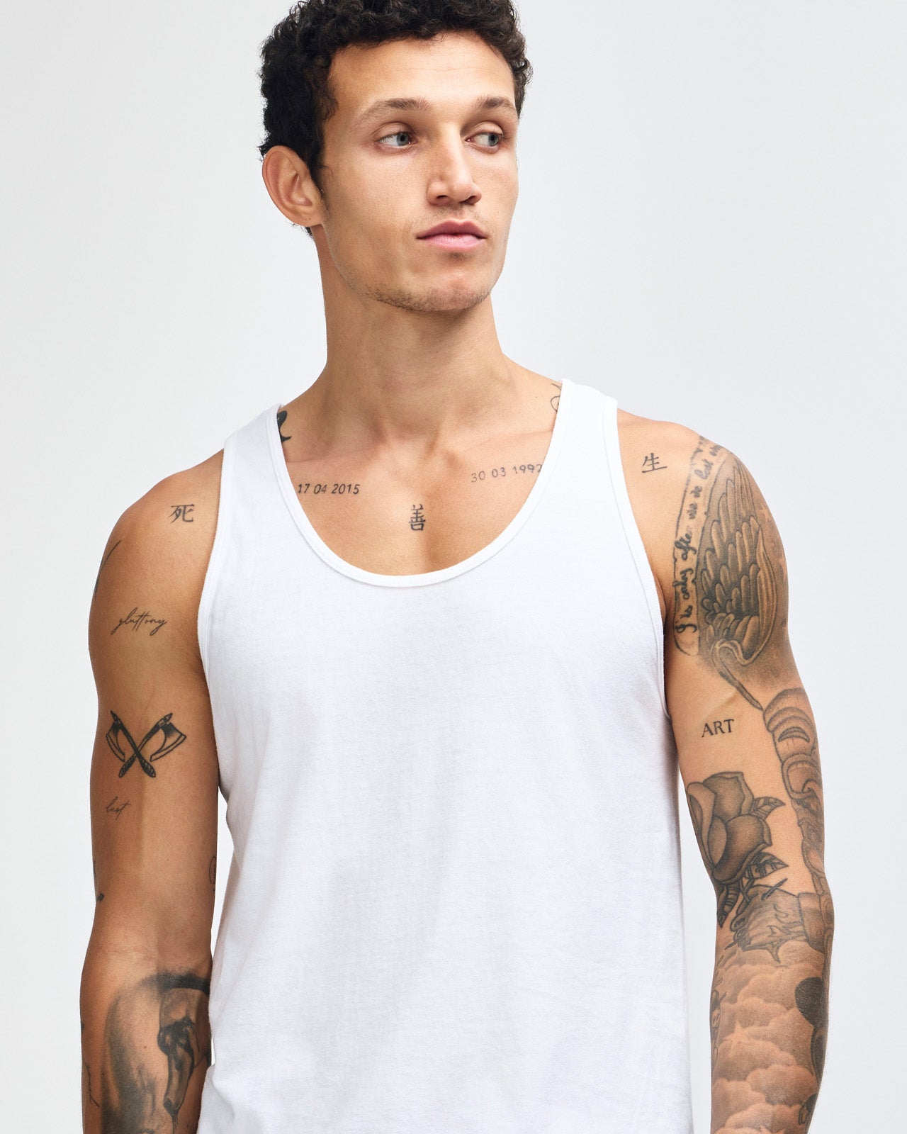 Male model wearing red colour American Apparel Fine Jersey Unisex Tank Top (front pose)-white