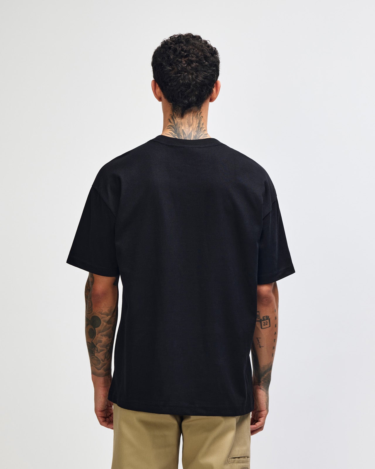 Male model wearing an American Apparel 9001 Unisex Oversized Fit Super Heavyweight T-shirt - black