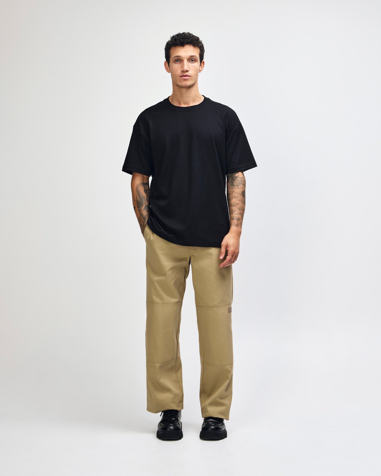 Male model wearing an American Apparel 9001 Unisex Oversized Fit Super Heavyweight T-shirt - black