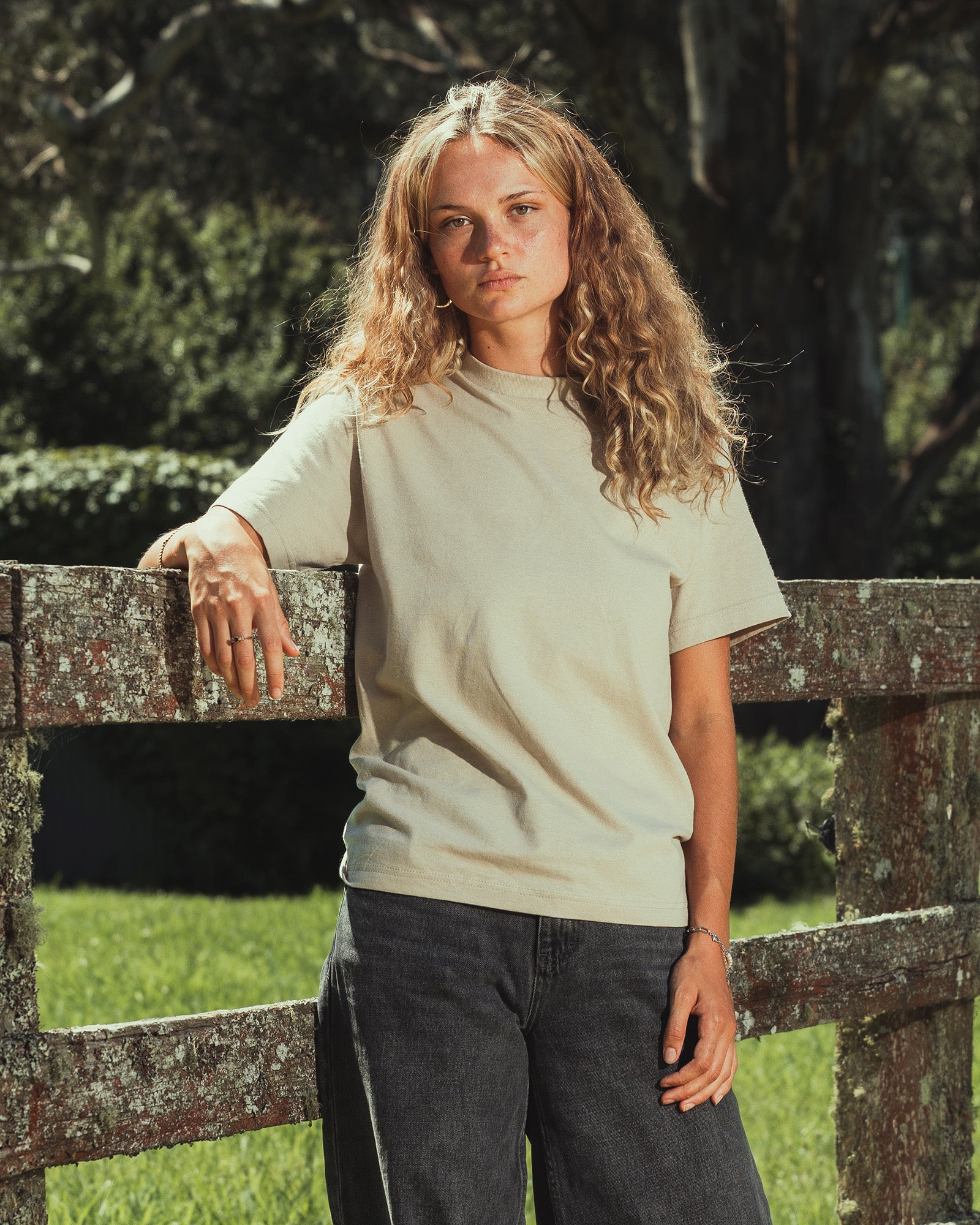 Female model wearing an American Apparel 9001 Unisex Oversized Fit Super Heavyweight T-shirt - bone