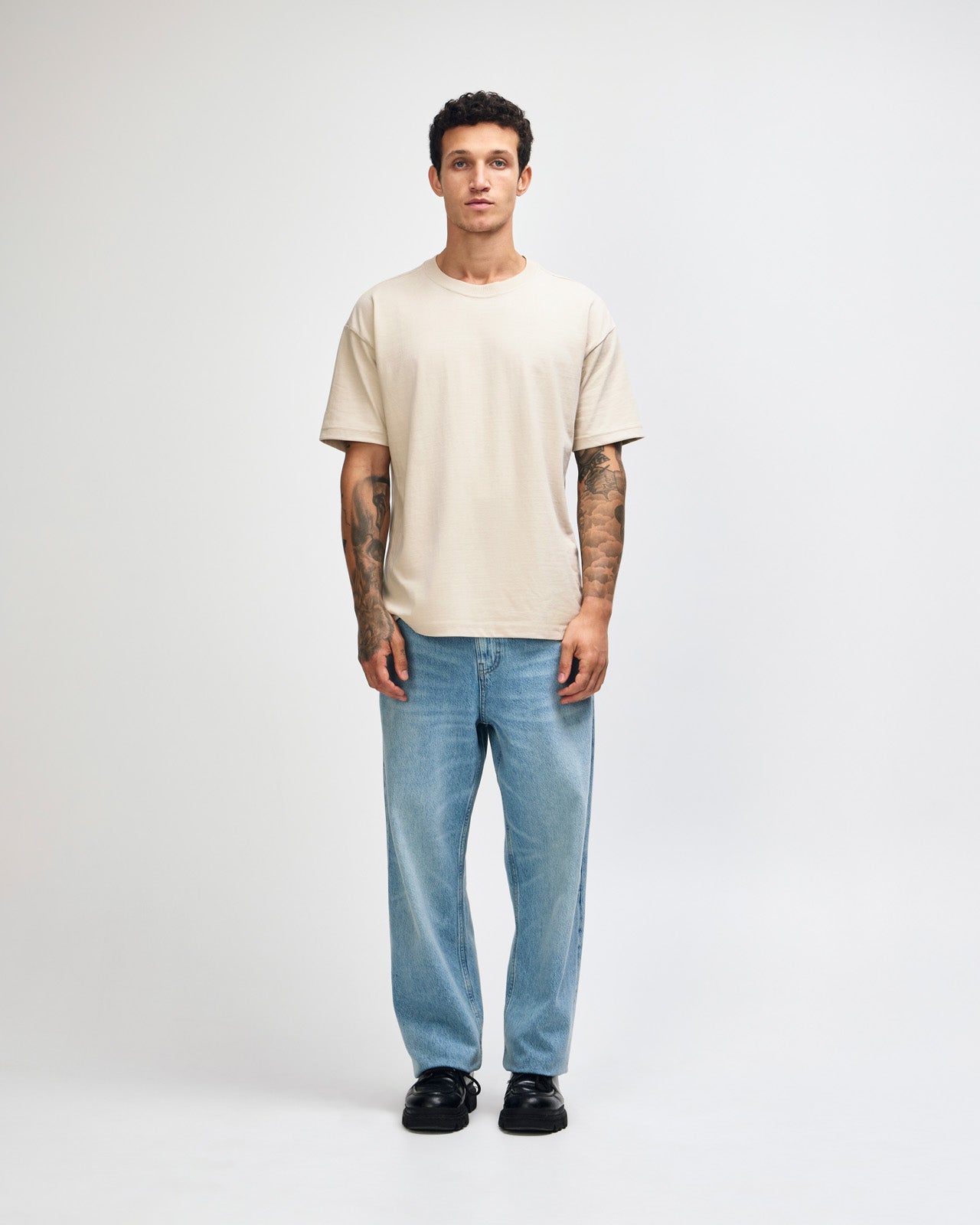 Male model wearing an American Apparel 9001 Unisex Oversized Fit Super Heavyweight T-shirt - bone