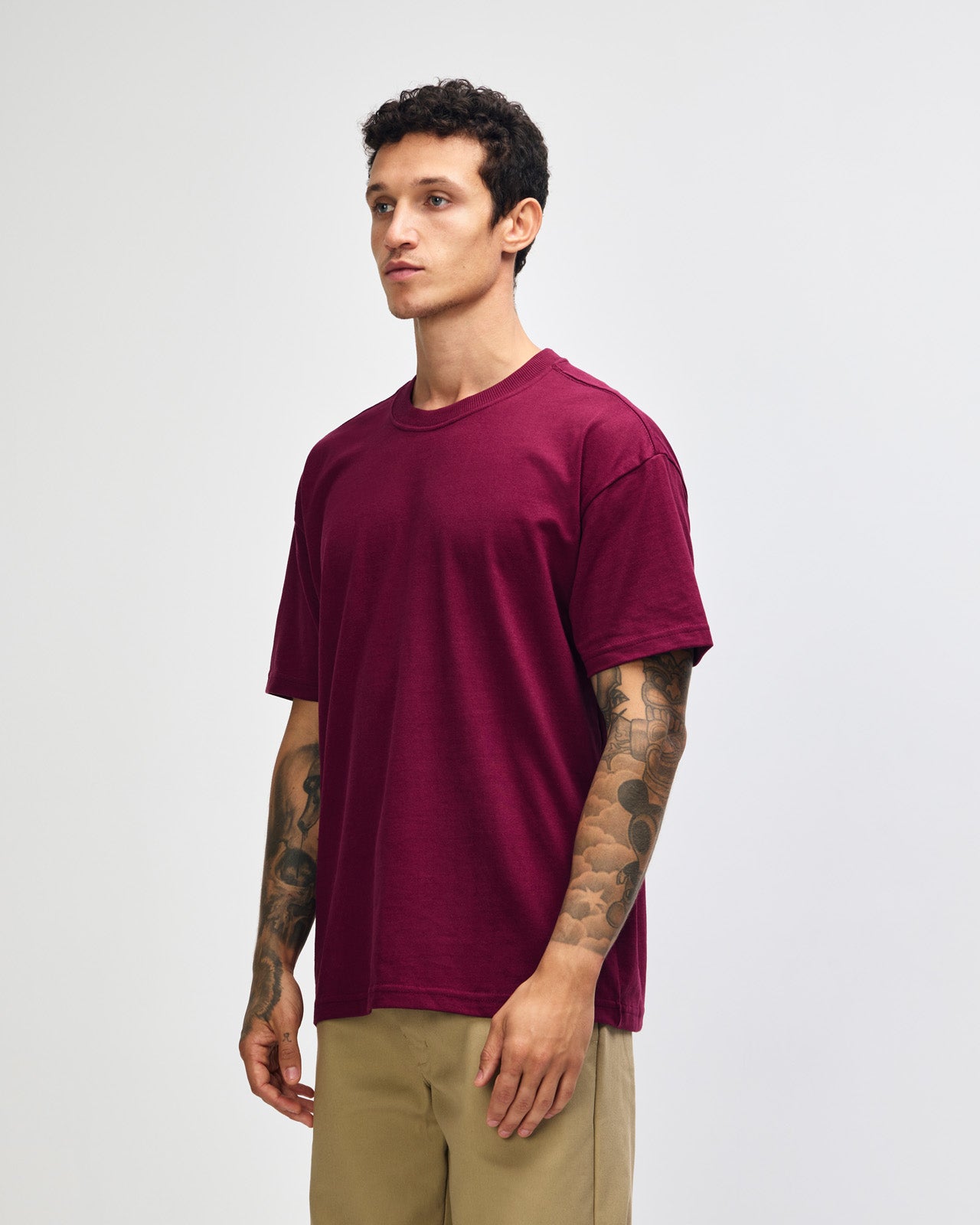 Male model wearing an American Apparel 9001 Unisex Oversized Fit Super Heavyweight T-shirt - burgundy