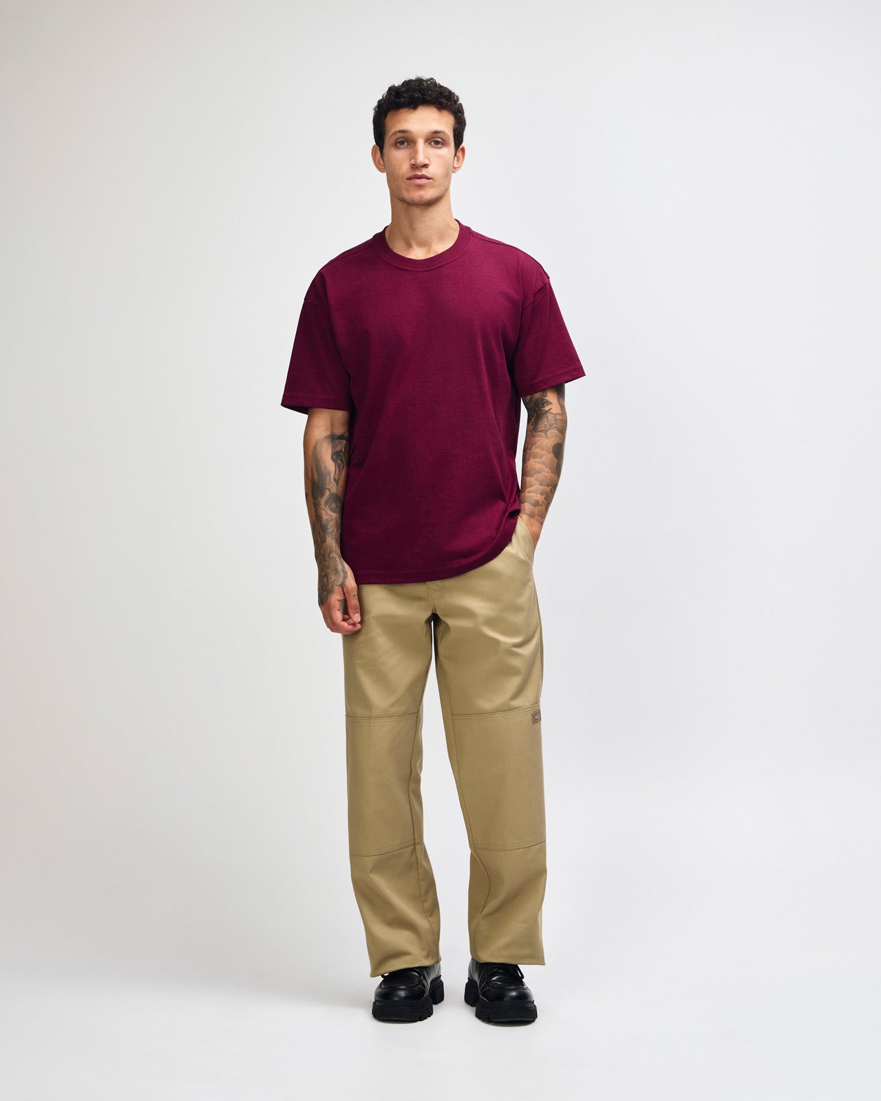 Male model wearing an American Apparel 9001 Unisex Oversized Fit Super Heavyweight T-shirt - burgundy