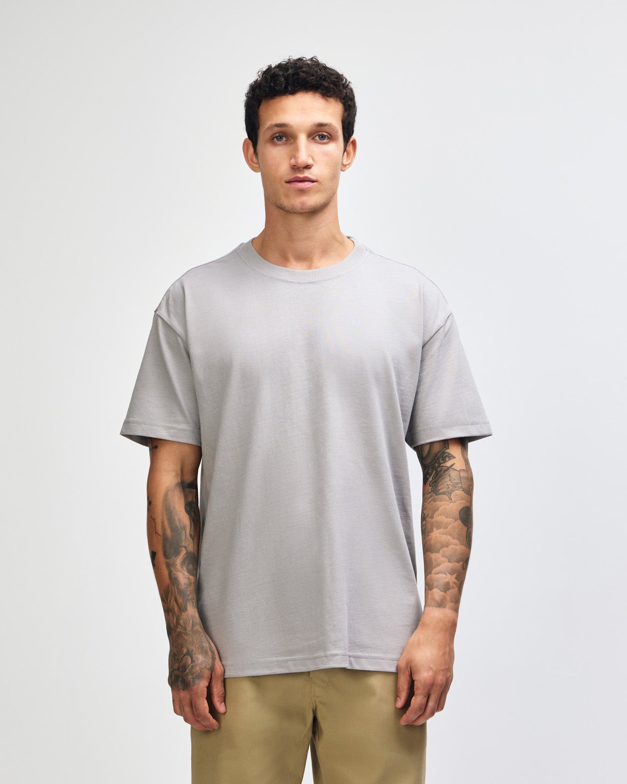 Male model wearing an American Apparel 9001 Unisex Oversized Fit Super Heavyweight T-shirt - Gravel