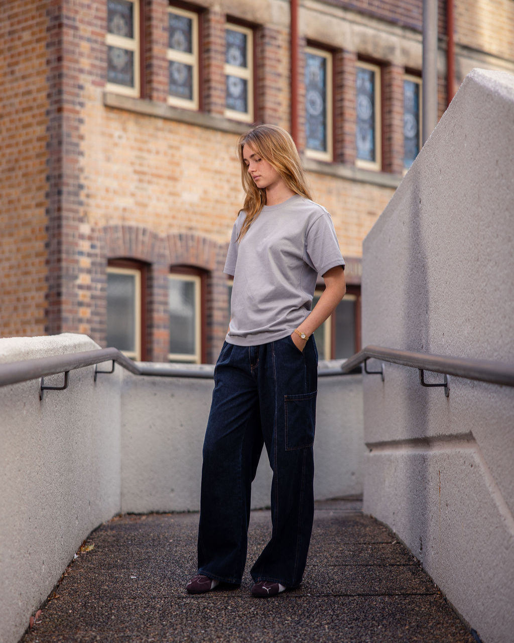 Female model wearing an American Apparel 9001 Unisex Oversized Fit Super Heavyweight T-shirt - Gravel