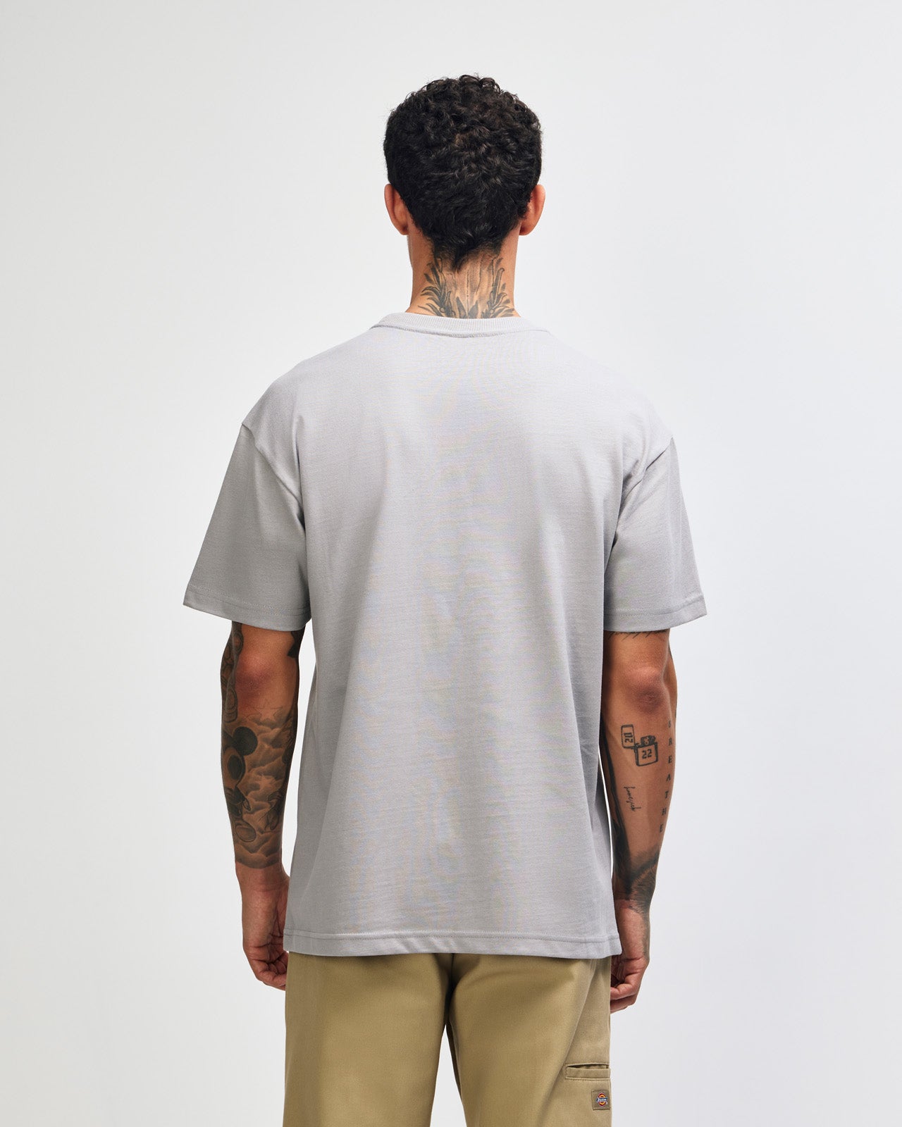 Male model wearing an American Apparel 9001 Unisex Oversized Fit Super Heavyweight T-shirt - Gravel