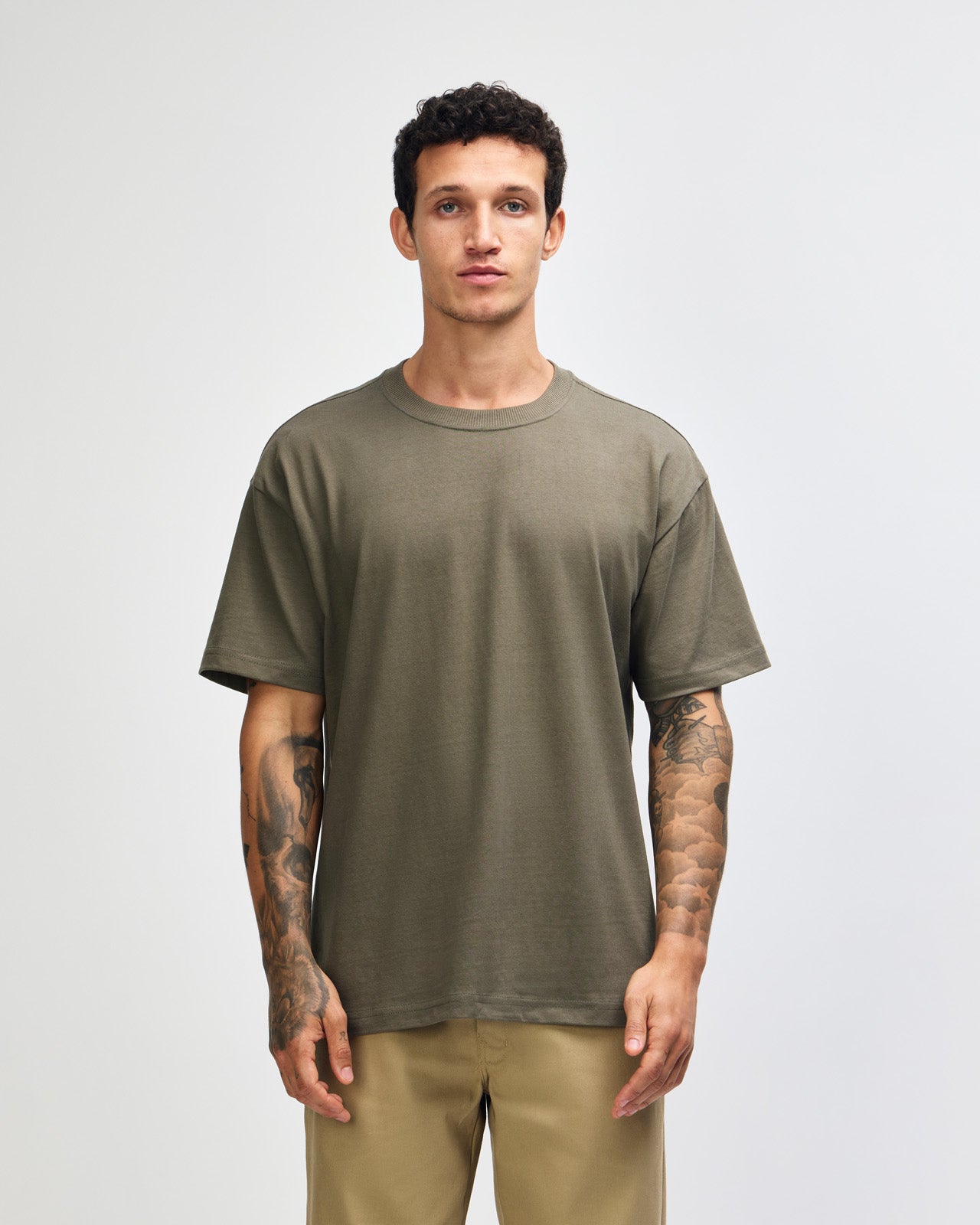 Male model wearing an American Apparel 9001 Unisex Oversized Fit Super Heavyweight T-shirt - lieutenant