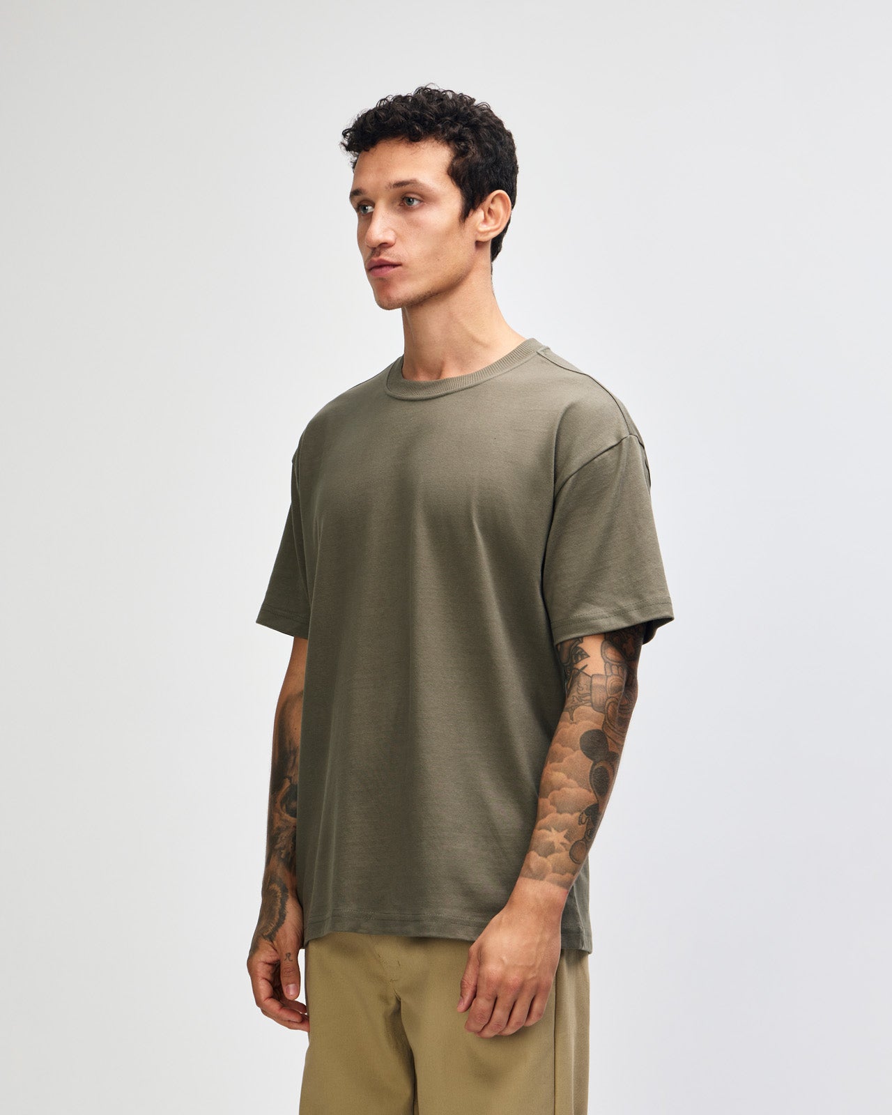 Male model wearing an American Apparel 9001 Unisex Oversized Fit Super Heavyweight T-shirt - lieutenant