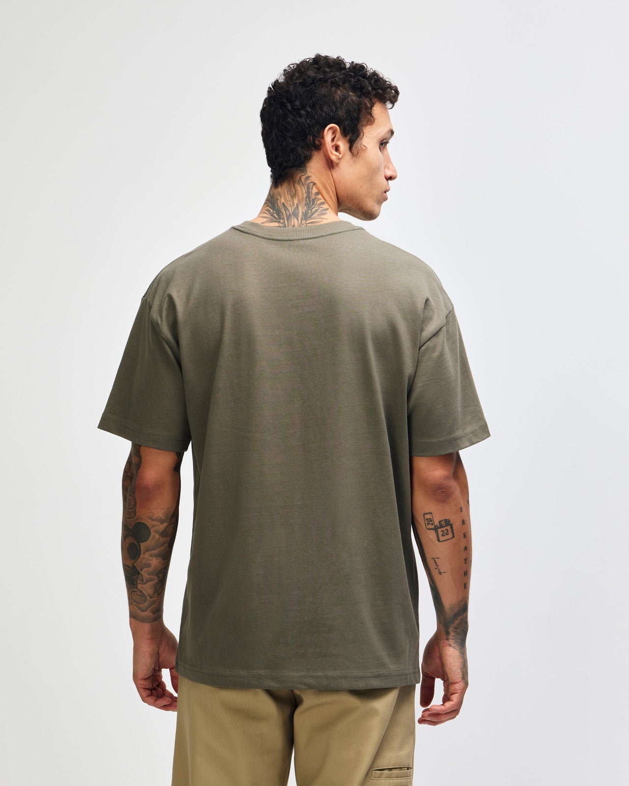 Male model wearing an American Apparel 9001 Unisex Oversized Fit Super Heavyweight T-shirt - lieutenant
