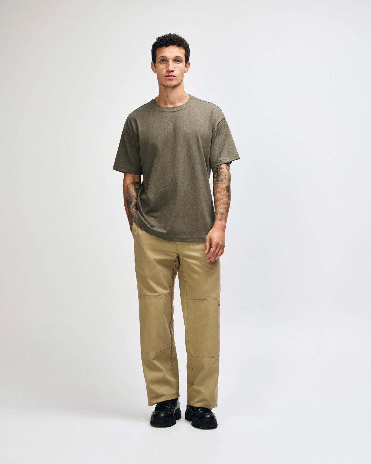 Male model wearing an American Apparel 9001 Unisex Oversized Fit Super Heavyweight T-shirt - lieutenant