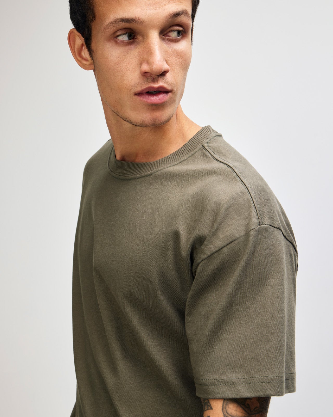 Male model wearing an American Apparel 9001 Unisex Oversized Fit Super Heavyweight T-shirt - lieutenant
