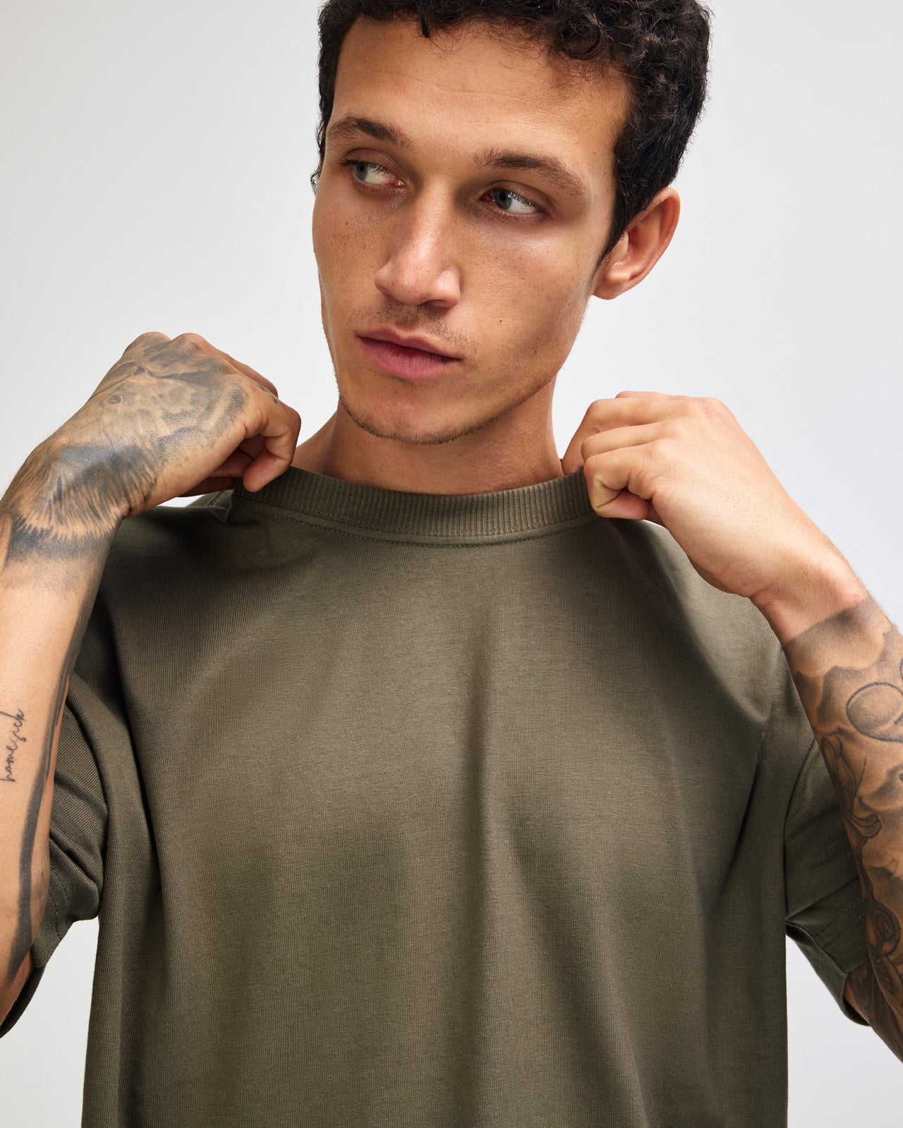 Male model wearing an American Apparel 9001 Unisex Oversized Fit Super Heavyweight T-shirt - lieutenant