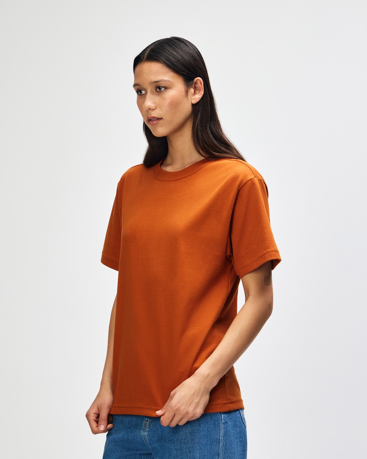 Female model wearing an American Apparel 9001 Unisex Oversized Fit Super Heavyweight T-shirt - Rust